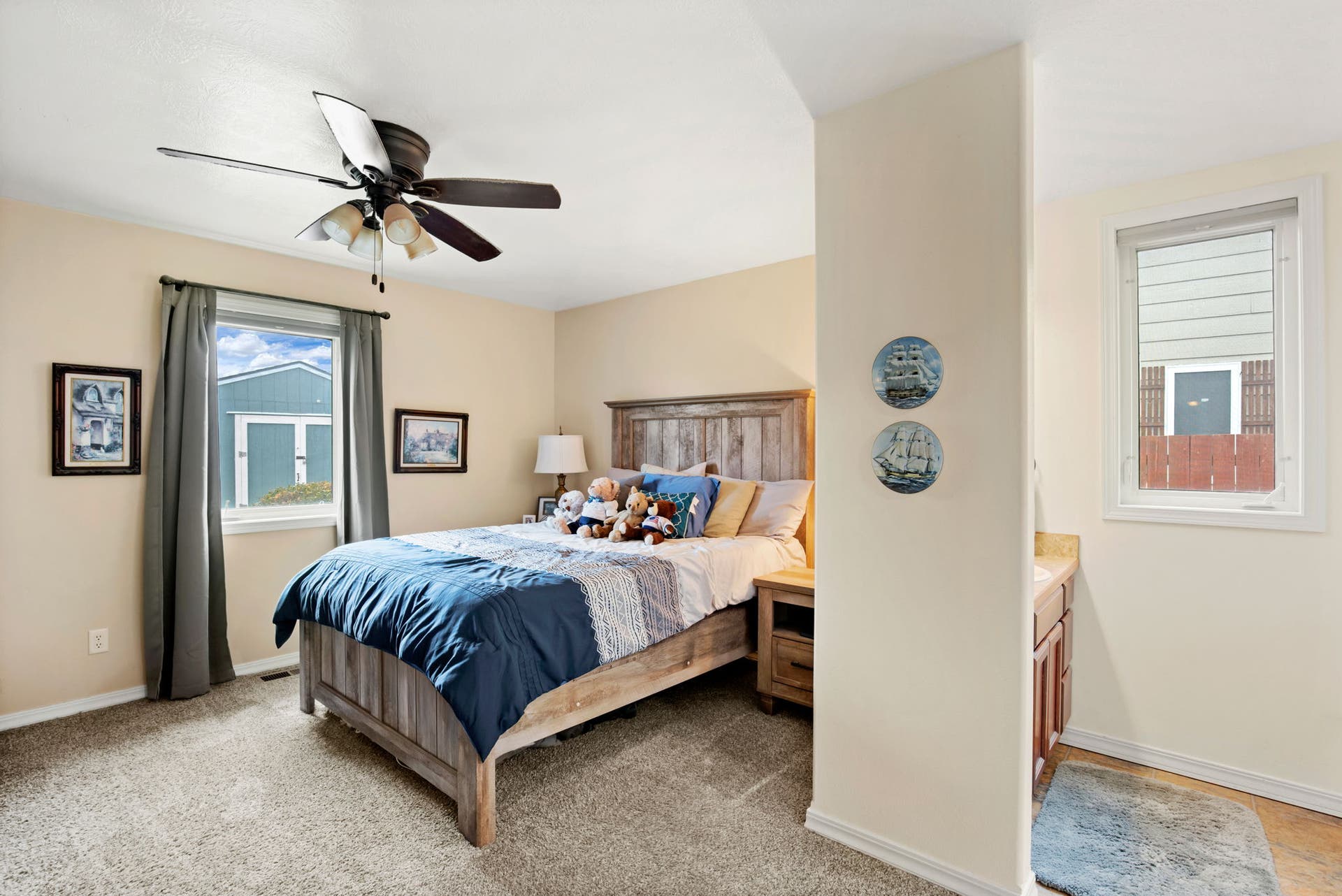 2541 Castle Pines Way, Great Falls, MT 59405 Built-in ceiling fan with light fixture, window with trim, and neutral-toned carpet