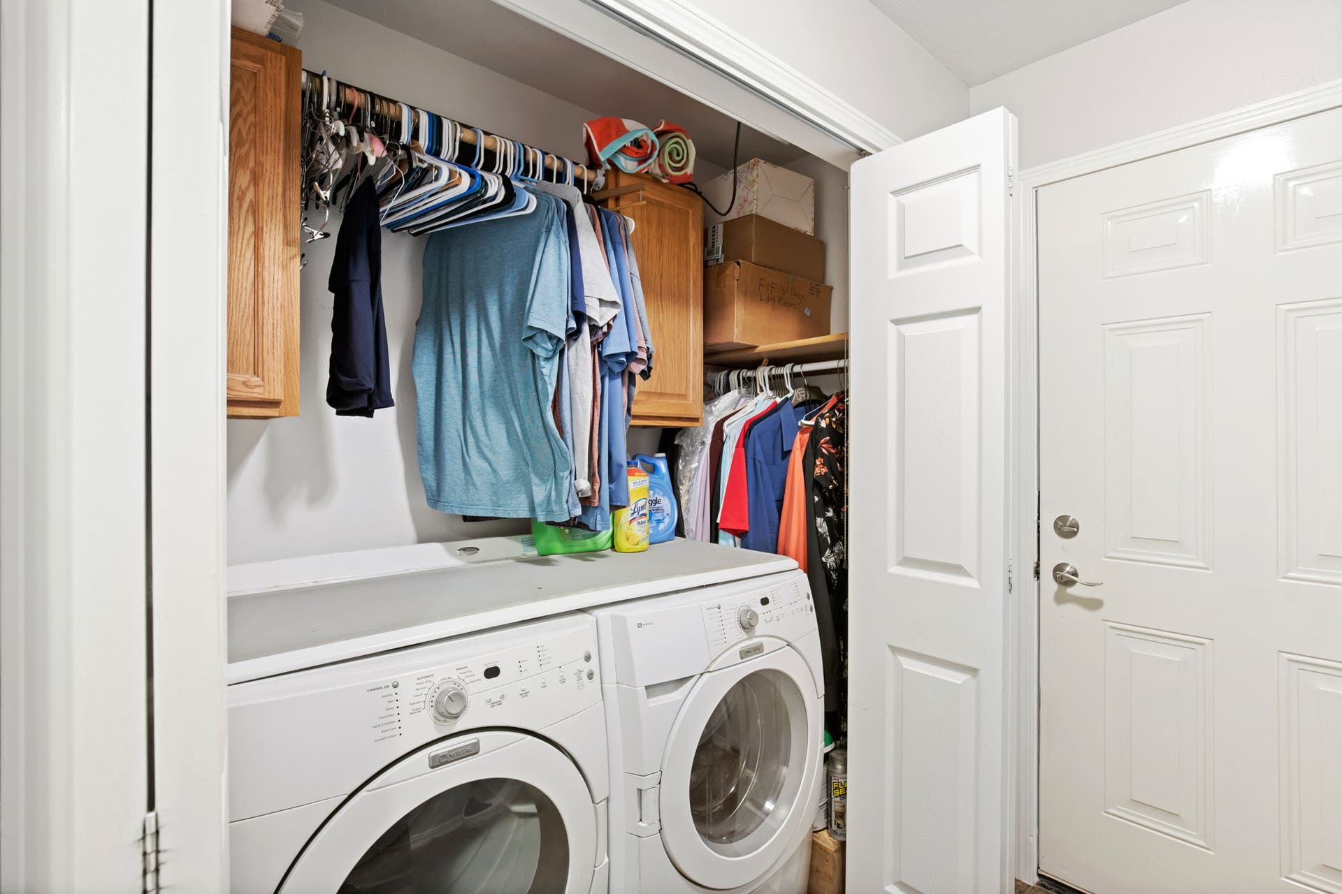 2541 Castle Pines Way, Great Falls, MT 59405 Laundry area featuring upper cabinetry, a hanging clothes rod, and a built-in shelf