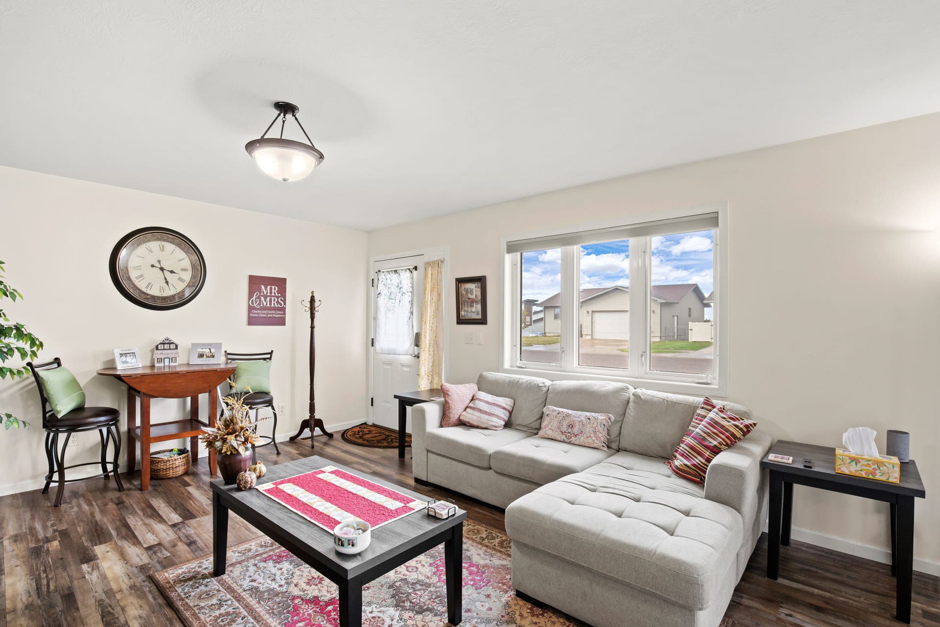 2541 Castle Pines Way, Great Falls, MT 59405 Wood-finish flooring throughout, light-toned walls, and a multi-pane window