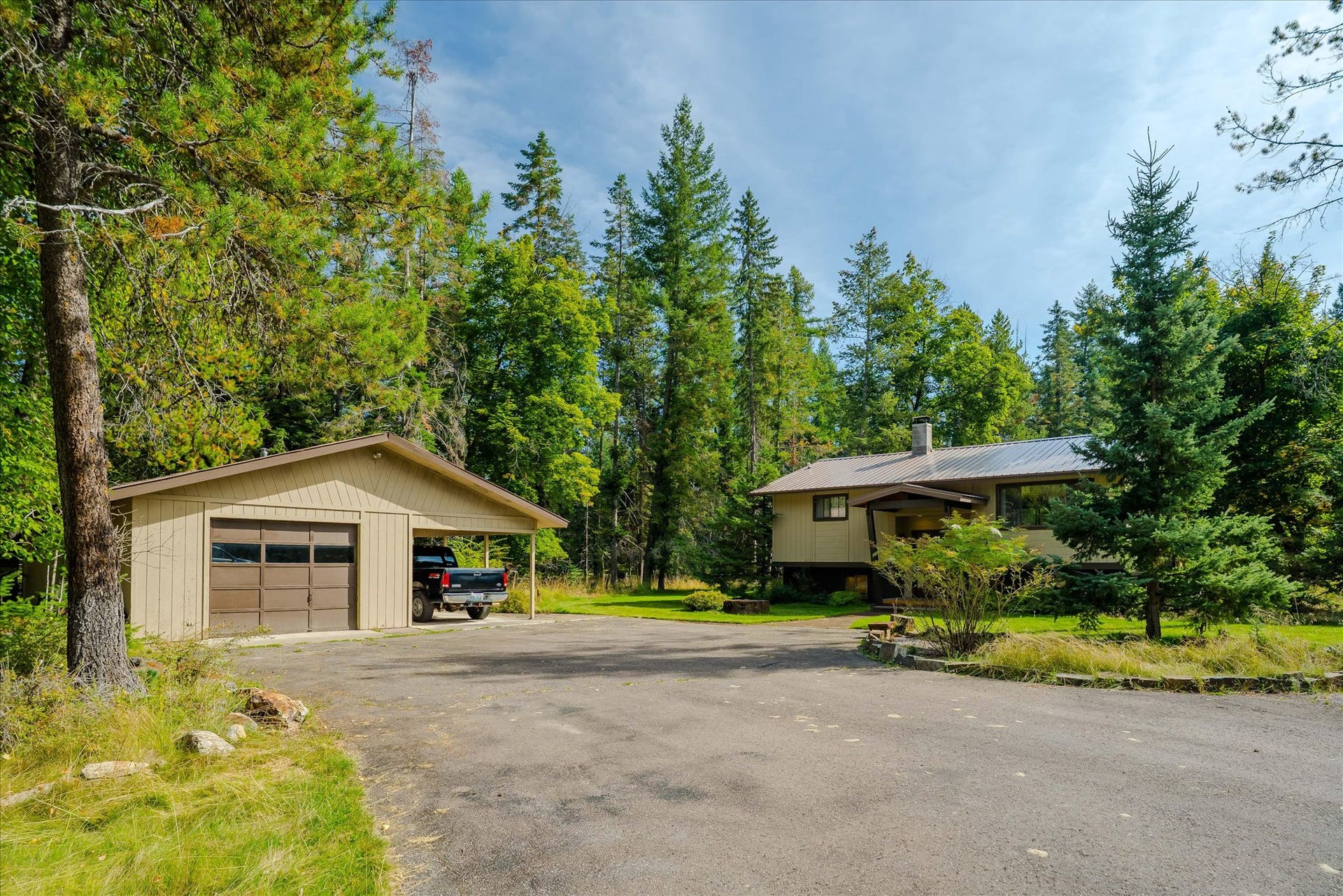 4955 Foothill Road, Bigfork, MT 59911 house and garage