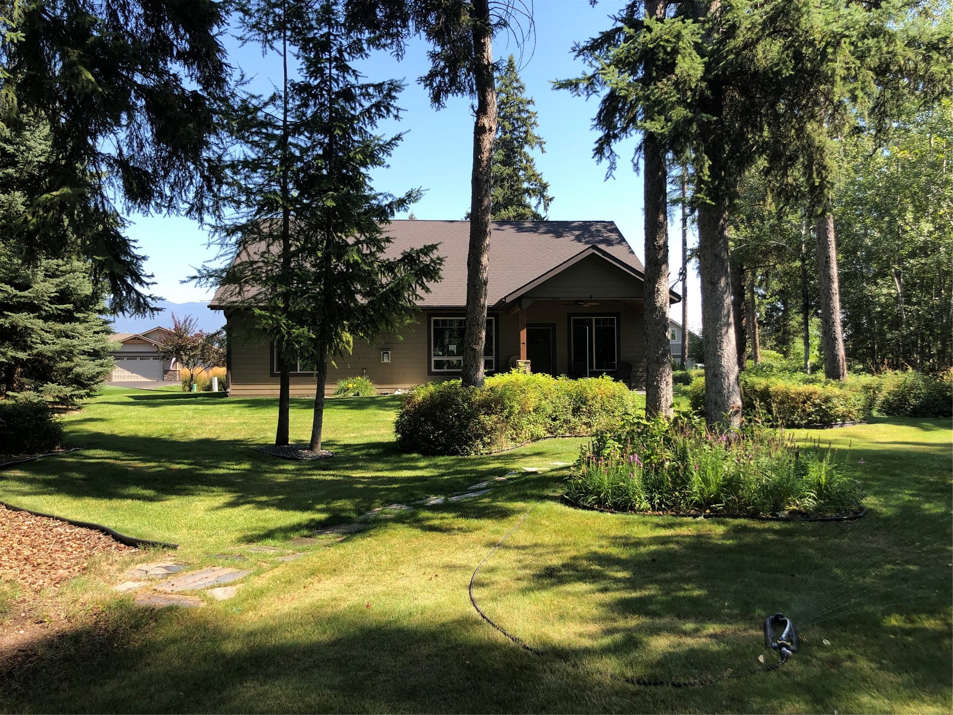 436 Forest Edge Trail, Kalispell, MT 59901 Back yard looking to patio