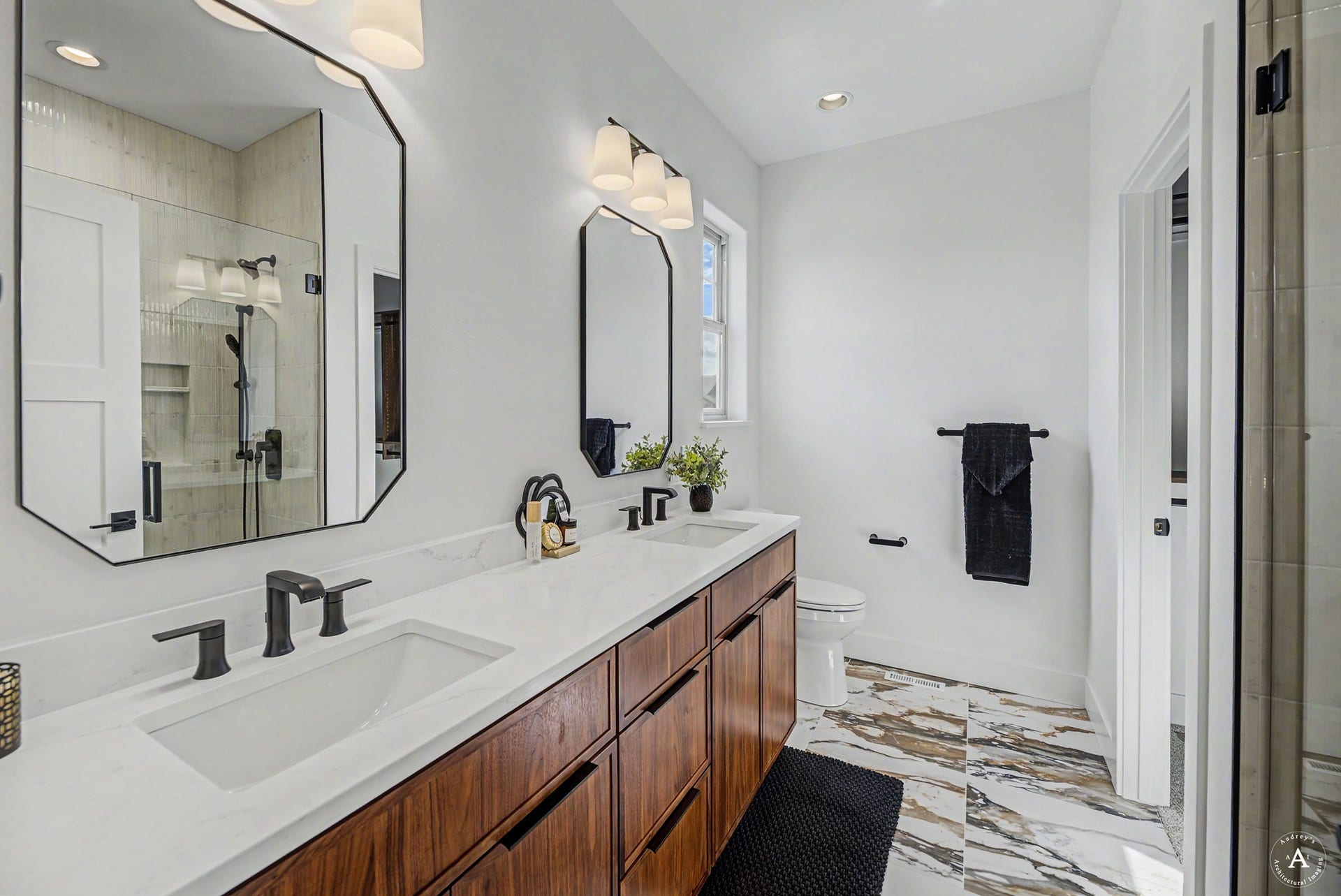 2754 Lone Chief Loop, Helena, MT 59601 Dual vanity with white countertop, integrated sinks, and dark wood-finish cabinetry