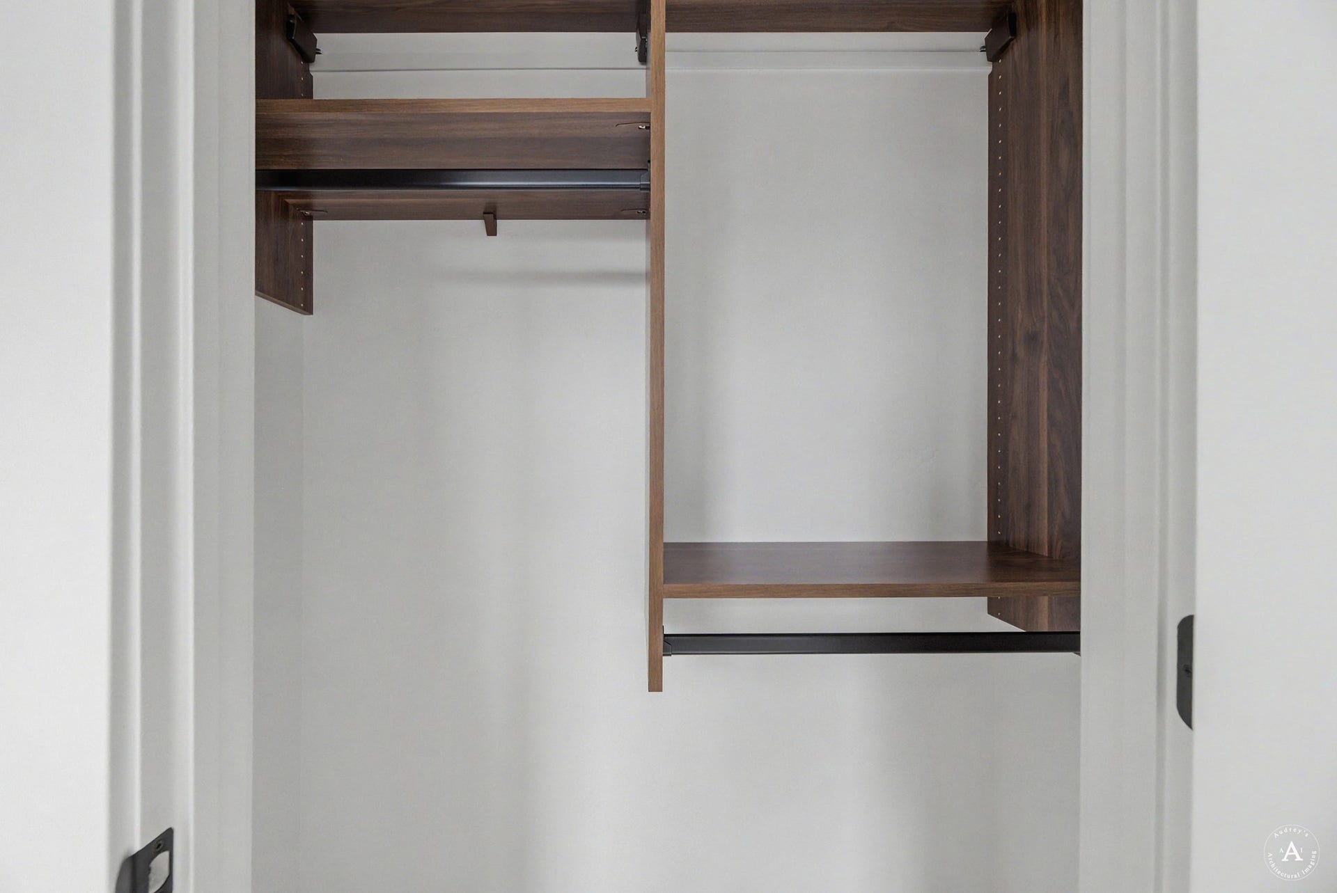 2754 Lone Chief Loop, Helena, MT 59601 Custom closet system featuring wood-finish shelving, multiple hanging rods, and adjustable shelf heights