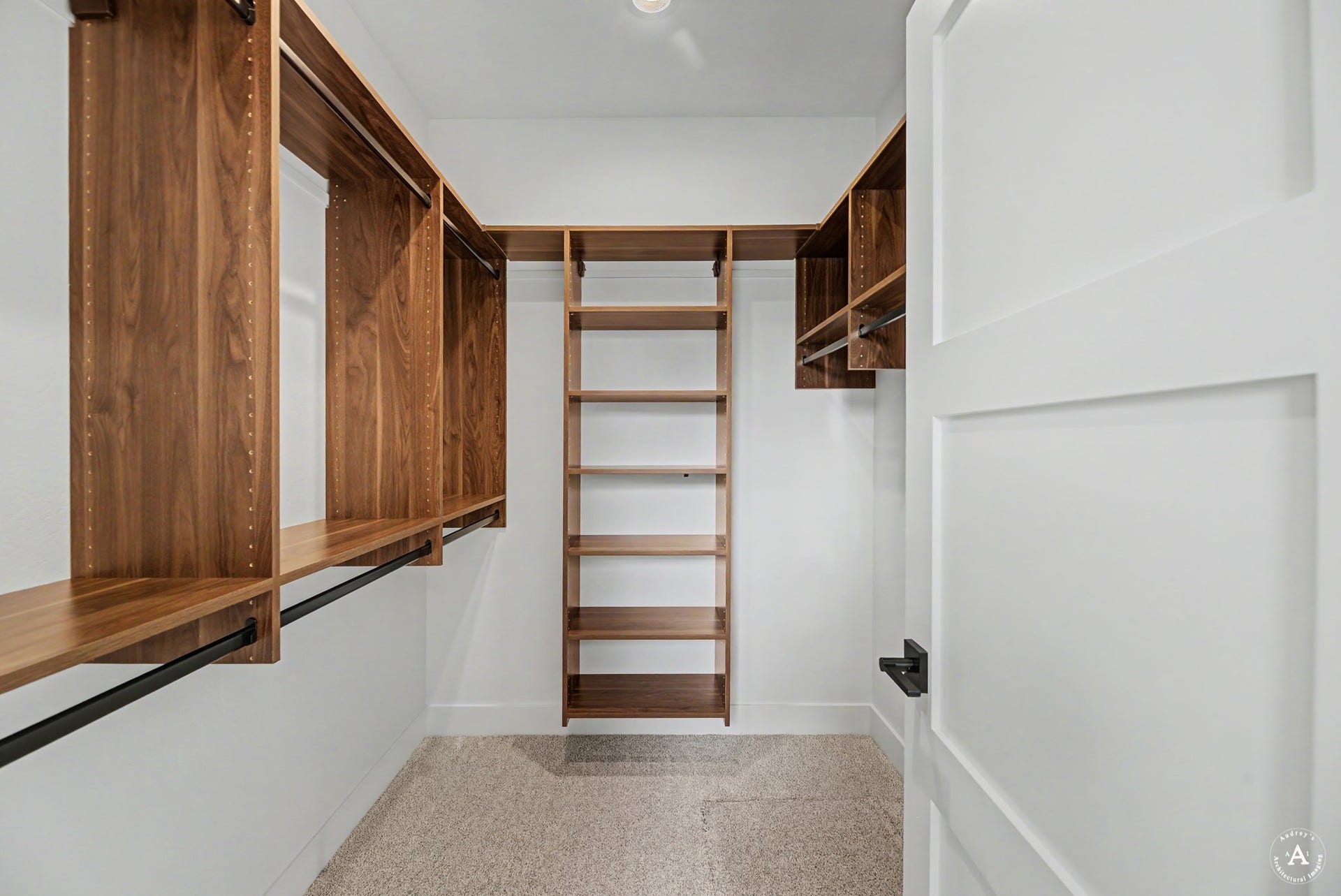 2754 Lone Chief Loop, Helena, MT 59601 Built-in closet system with rich wood-finish shelving and metal hanging rods
