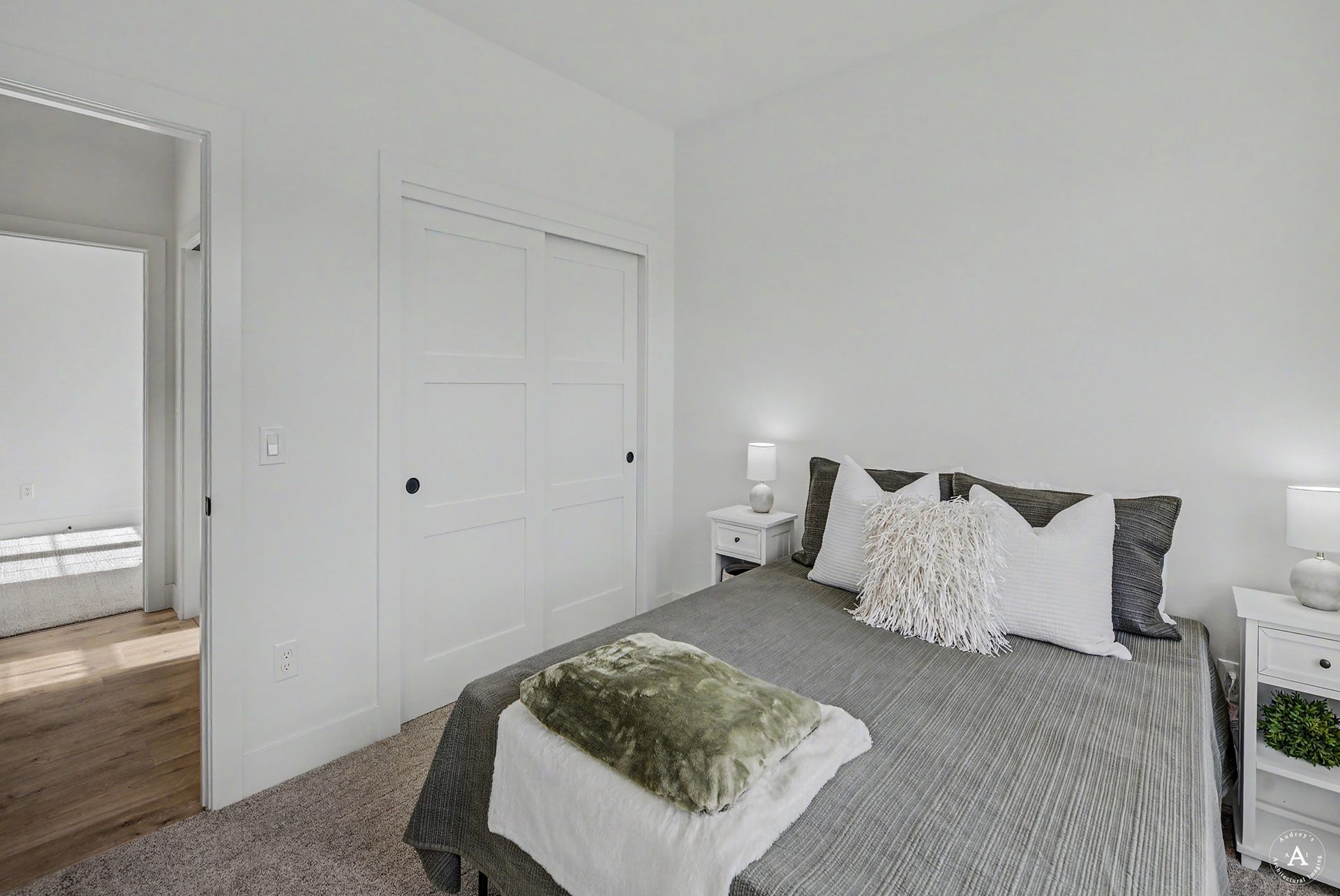 2754 Lone Chief Loop, Helena, MT 59601 White interior walls, carpet flooring, wood-finish flooring visible through doorway, white sliding panel closet doors, and black door hardware
