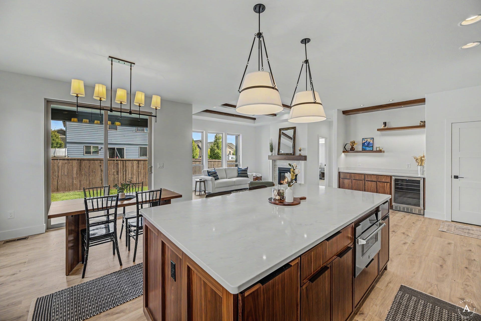 2754 Lone Chief Loop, Helena, MT 59601 Spacious kitchen island with a light-toned countertop, integrated microwave, and rich wood-finish cabinetry