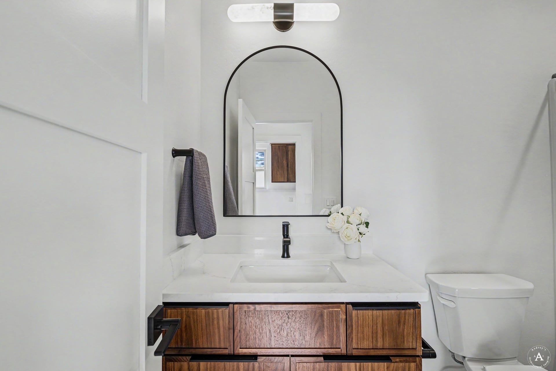 2754 Lone Chief Loop, Helena, MT 59601 Vanity with wood-finish cabinetry, white countertop, and integrated sink