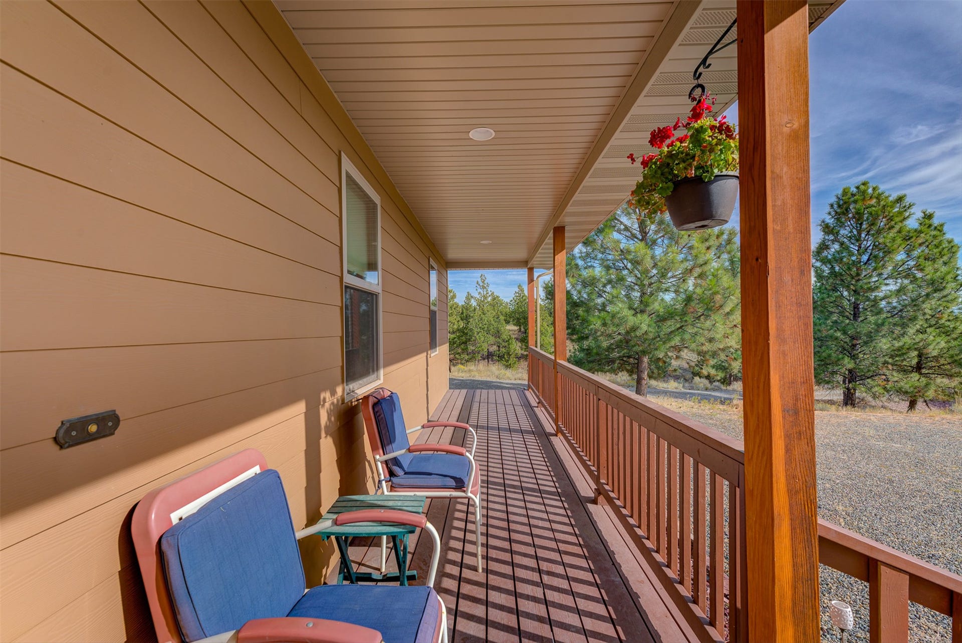 8224 Hillside Drive, Helena, MT 59602 Expansive covered front porch featuring wood-finish flooring, sturdy wood pillars, and a matching wood railing