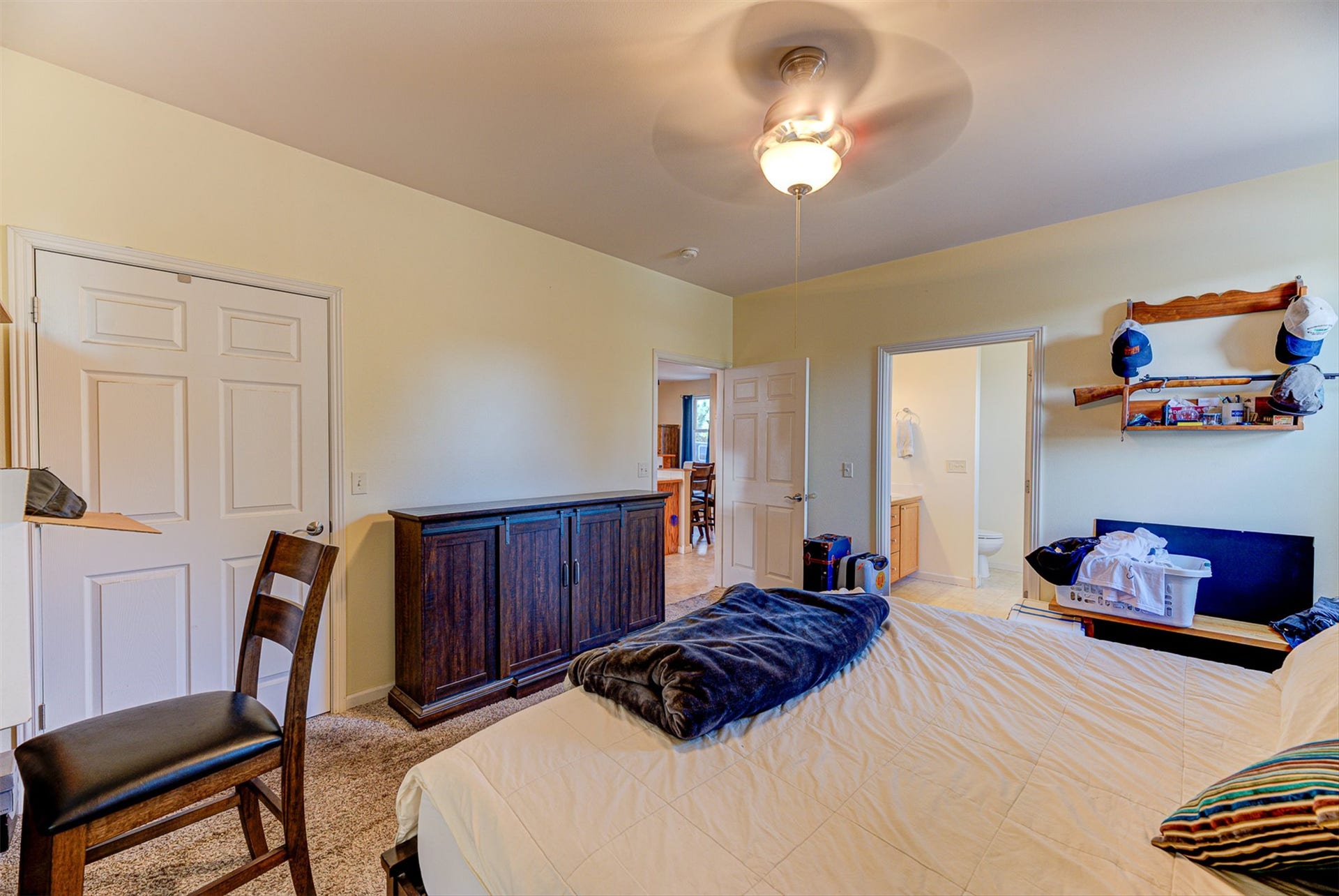 8224 Hillside Drive, Helena, MT 59602 Carpeted room with a ceiling fan light fixture