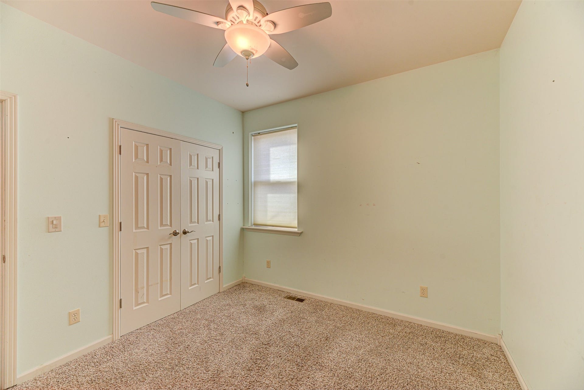 8224 Hillside Drive, Helena, MT 59602 Textured carpeting and a ceiling fan with integrated lighting