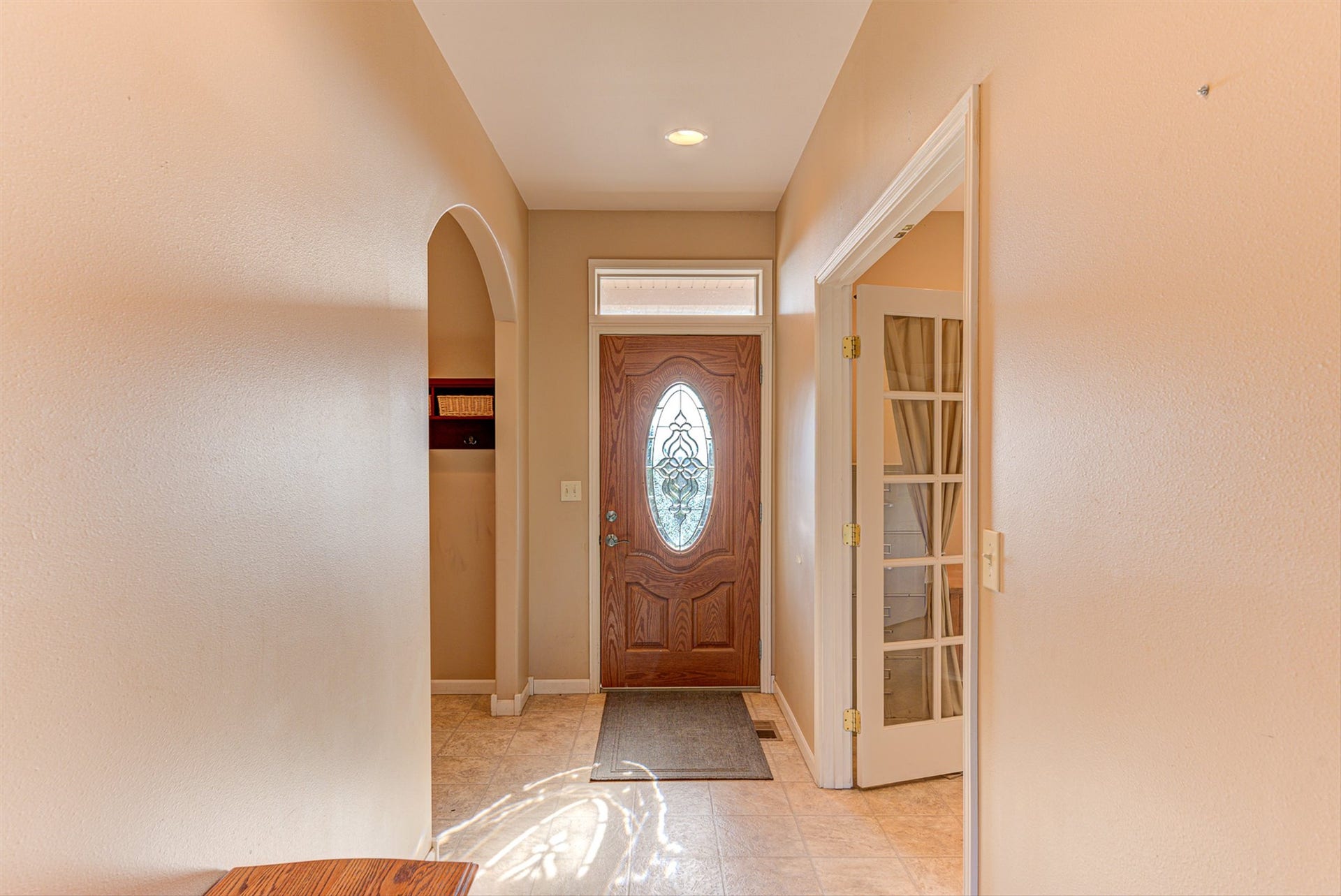 8224 Hillside Drive, Helena, MT 59602 Wood-finish entry door with leaded glass insert and transom window