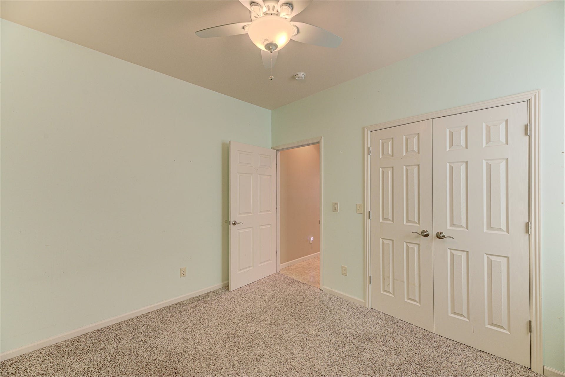 8224 Hillside Drive, Helena, MT 59602 Wall-to-wall carpeting, ceiling fan with light fixture, and two panel doors with satin nickel hardware
