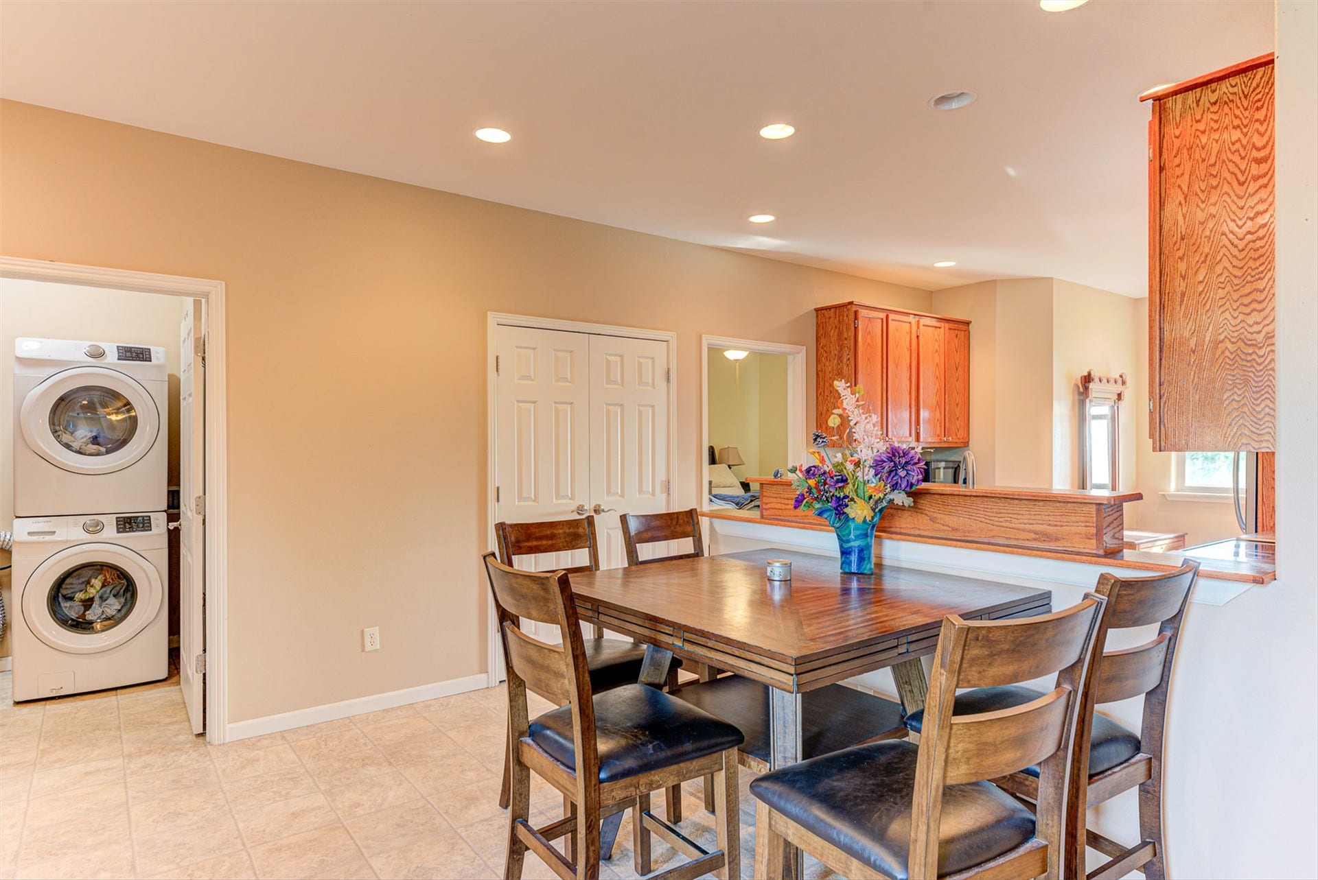 8224 Hillside Drive, Helena, MT 59602 Tiled flooring, recessed lighting, and a pass-through kitchen with wood cabinetry