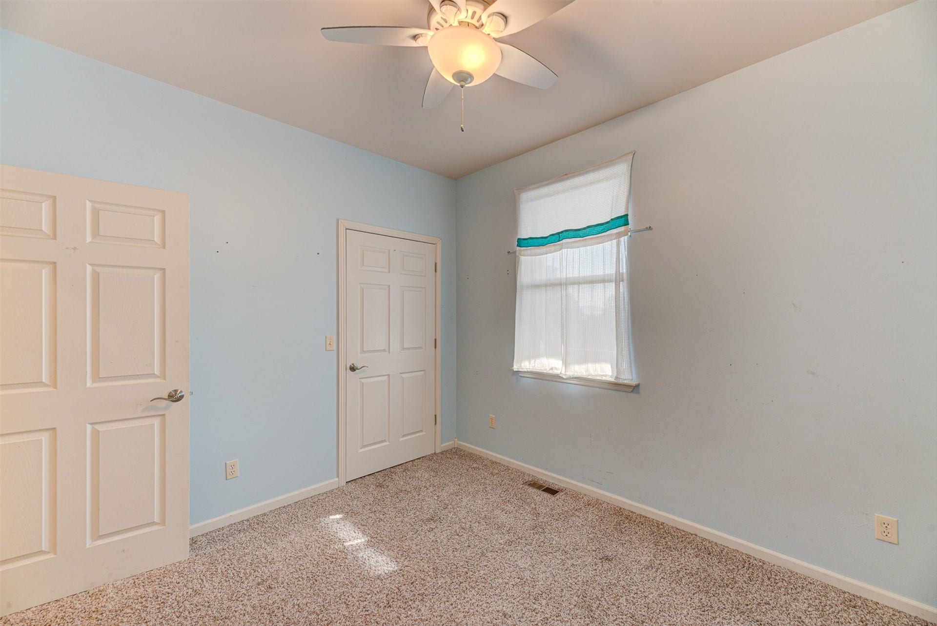 8224 Hillside Drive, Helena, MT 59602 Wall-to-wall carpeting, two panel doors with chrome hardware, and a ceiling fan with integrated lighting