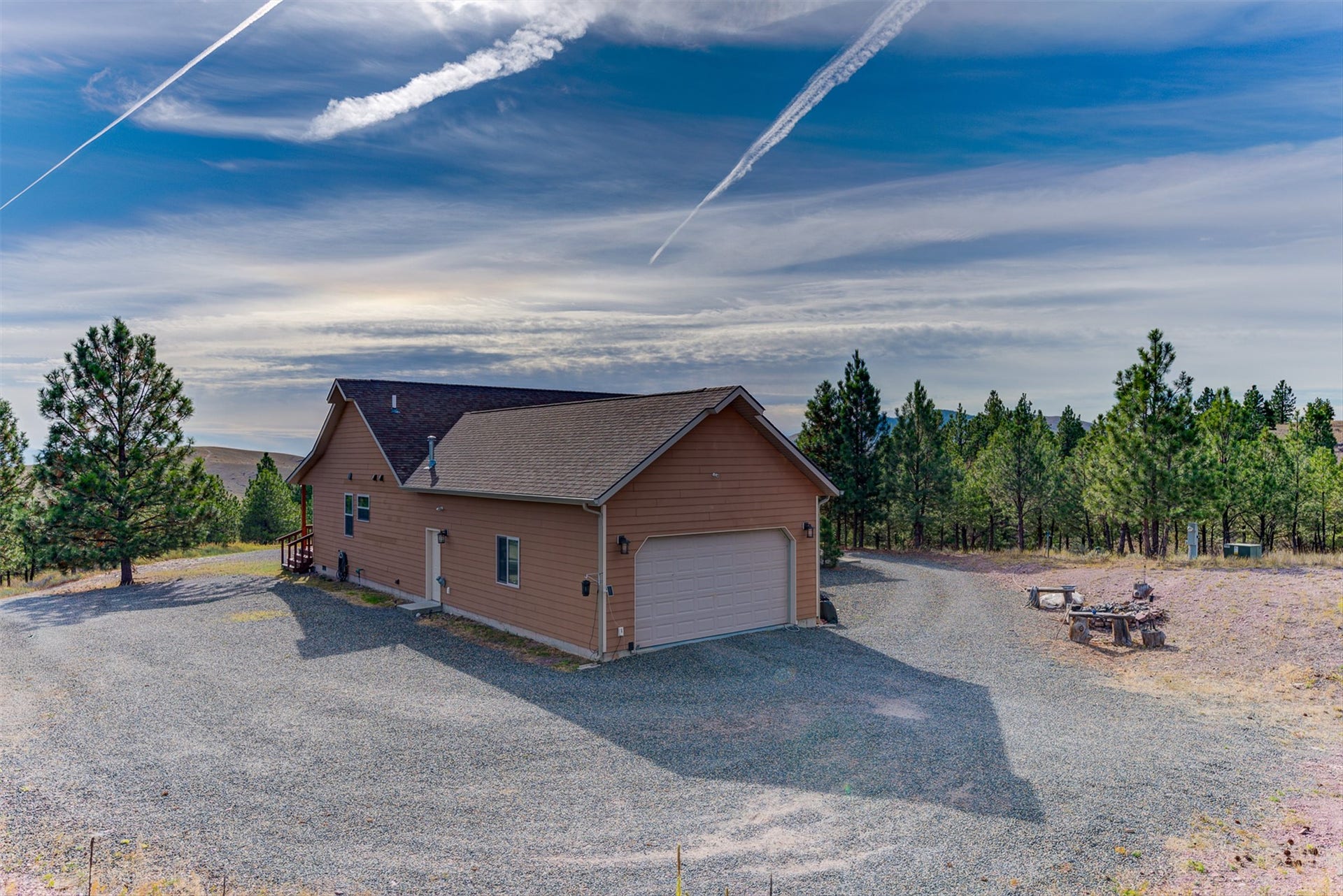 8224 Hillside Drive, Helena, MT 59602 Siding exterior with attached two-car garage