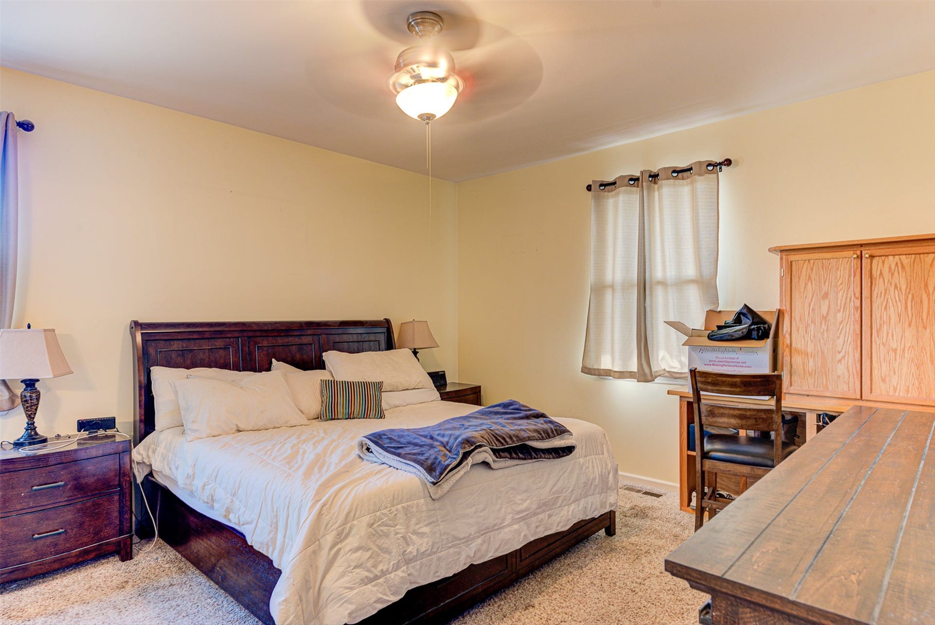 8224 Hillside Drive, Helena, MT 59602 Soft yellow wall finish, ceiling-mounted light fixture, and window with neutral drapery