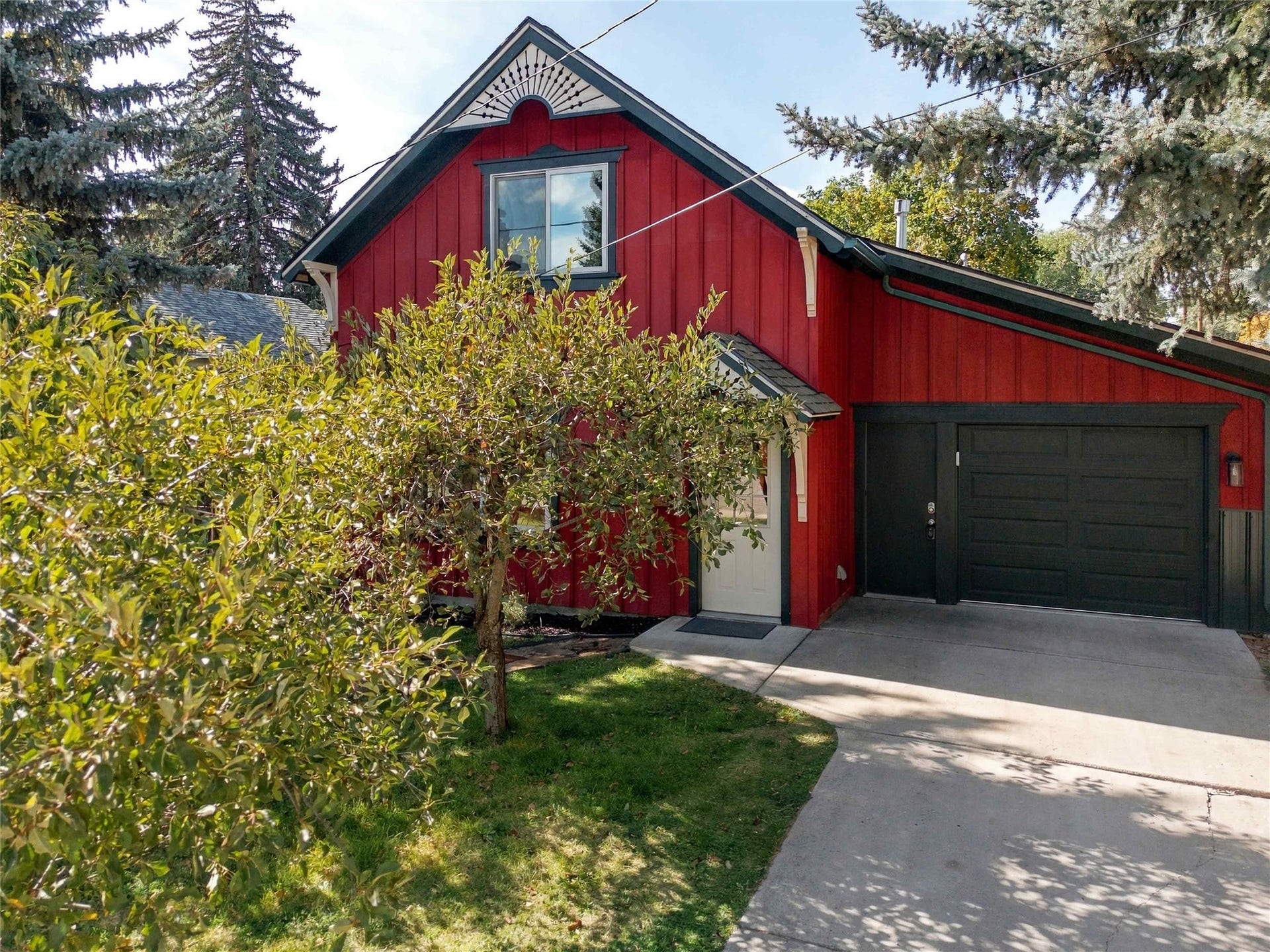 Red vertical siding exterior with contrasting dark trim