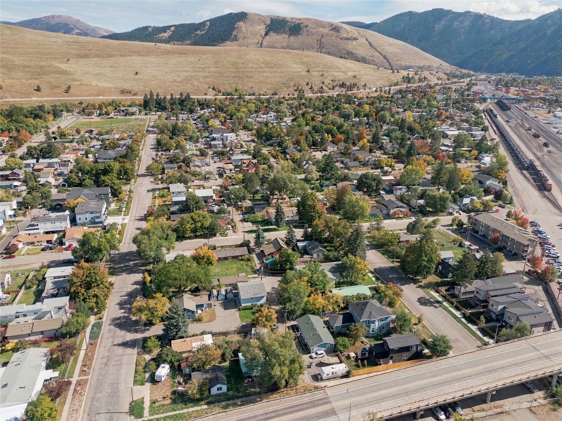 Residential area with established landscaping and mountain backdrop