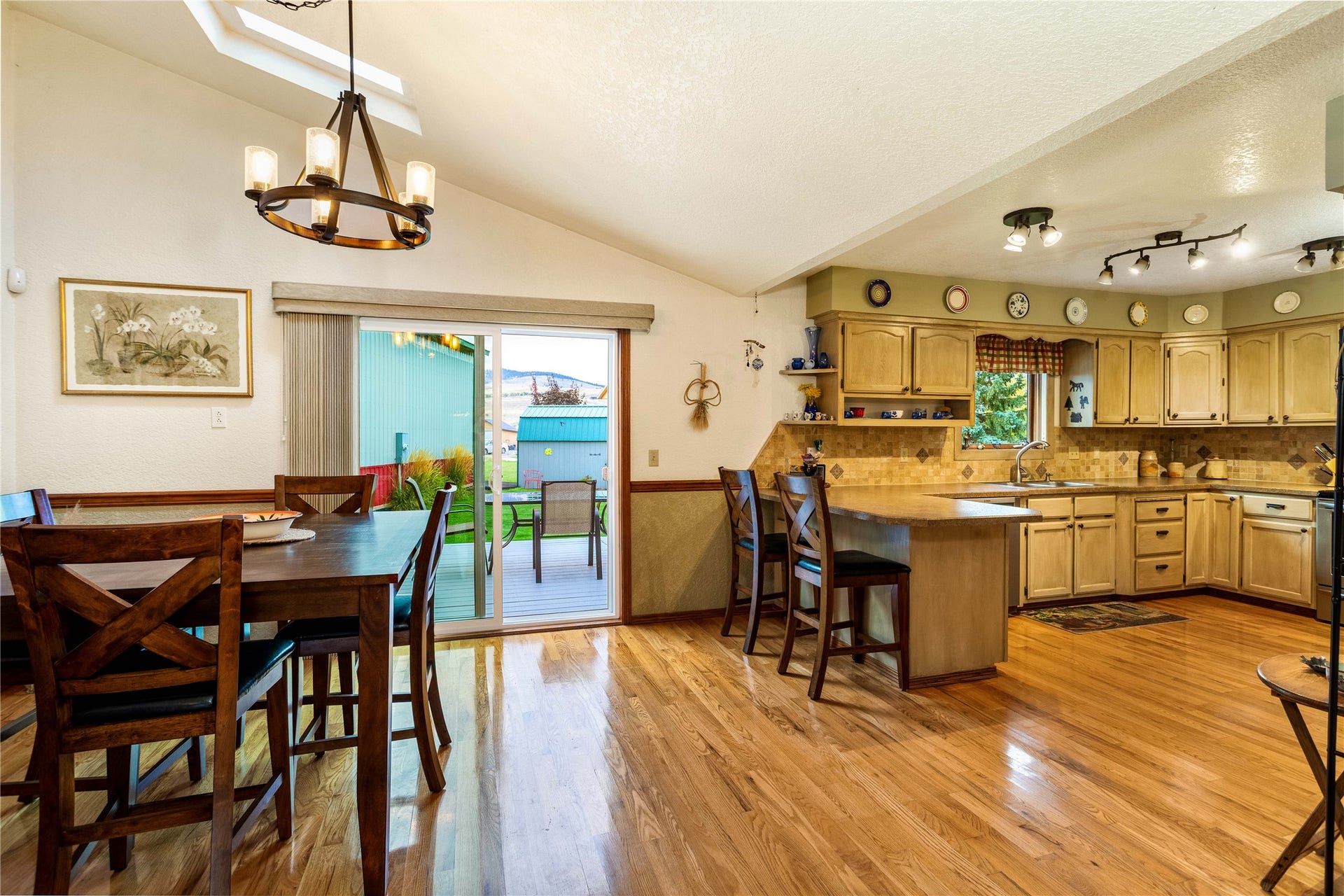 Open dining to kitchen to back deck area