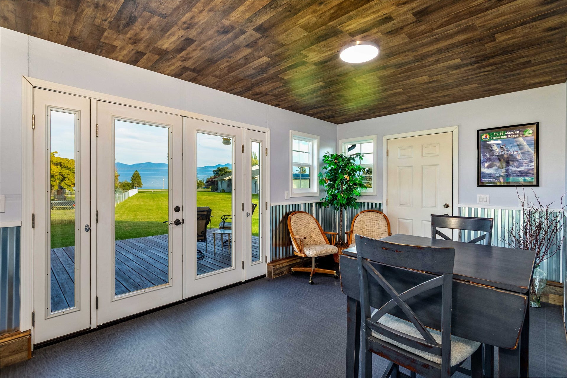 Sun Room with deck. This faces east and has views of the Mission Mountains