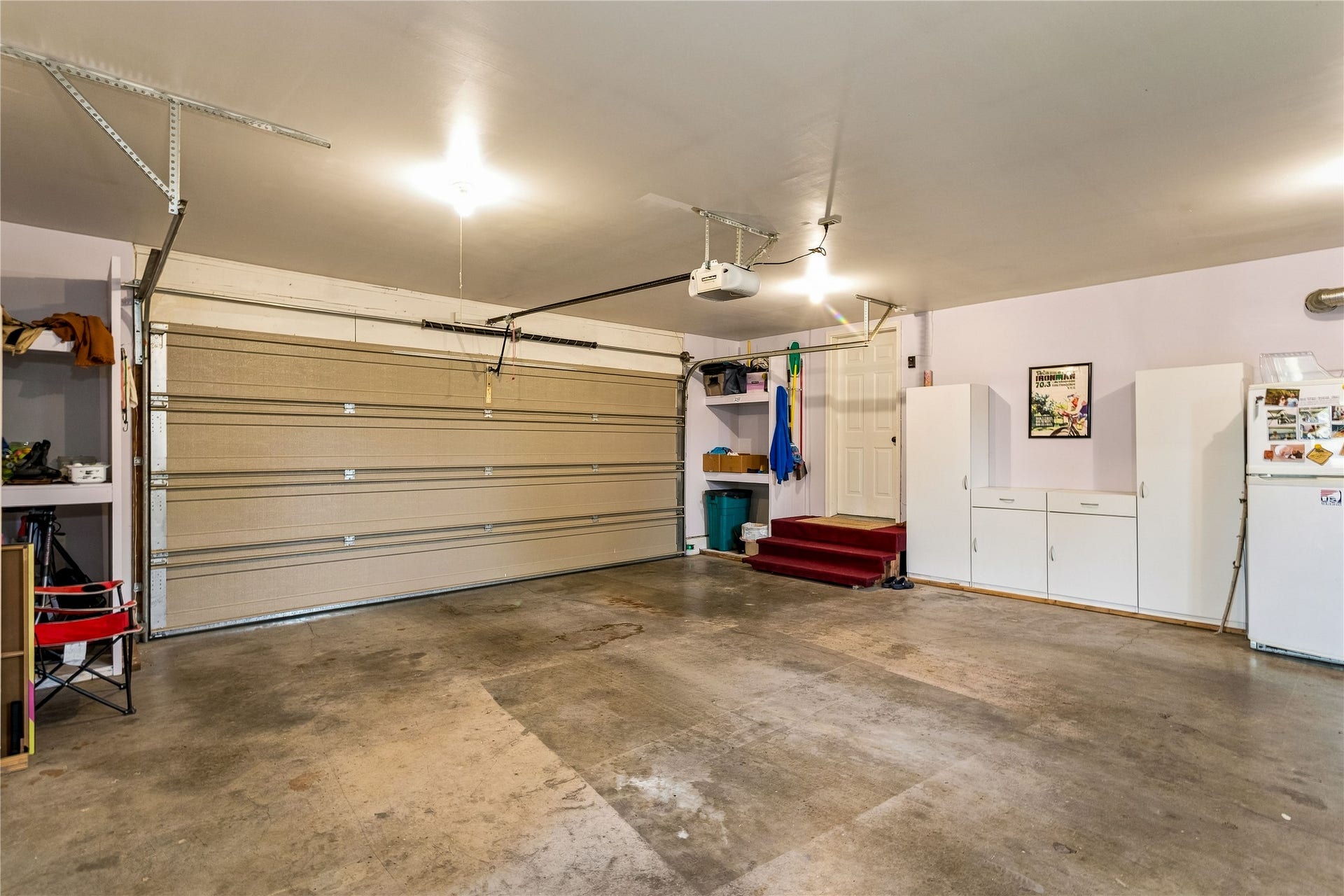 Garage with double door and storage shelves