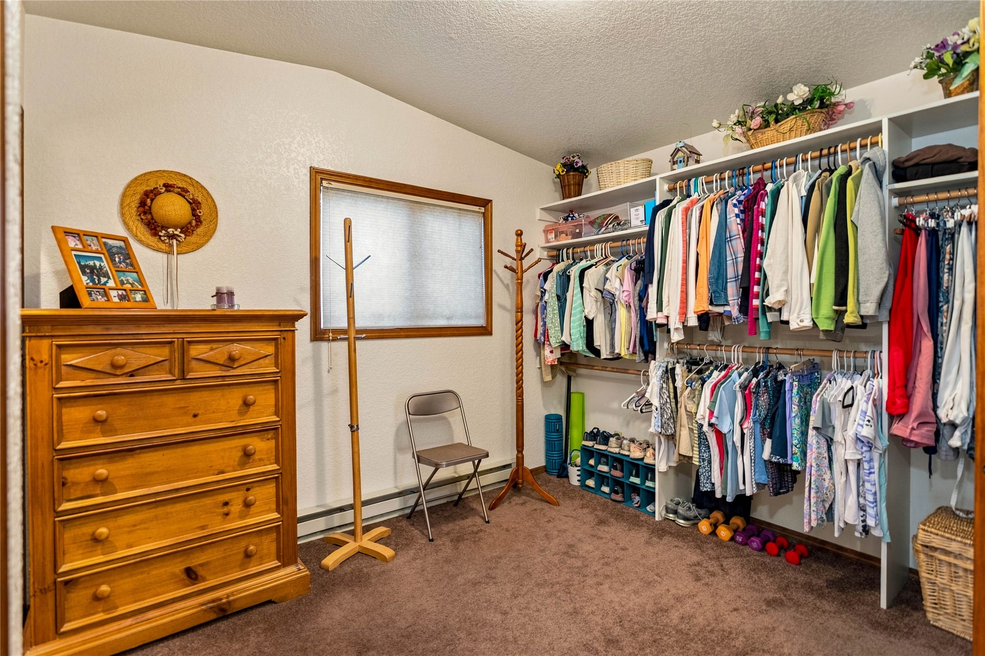Bedroom currently set up as closet creating a master suite on the upper level