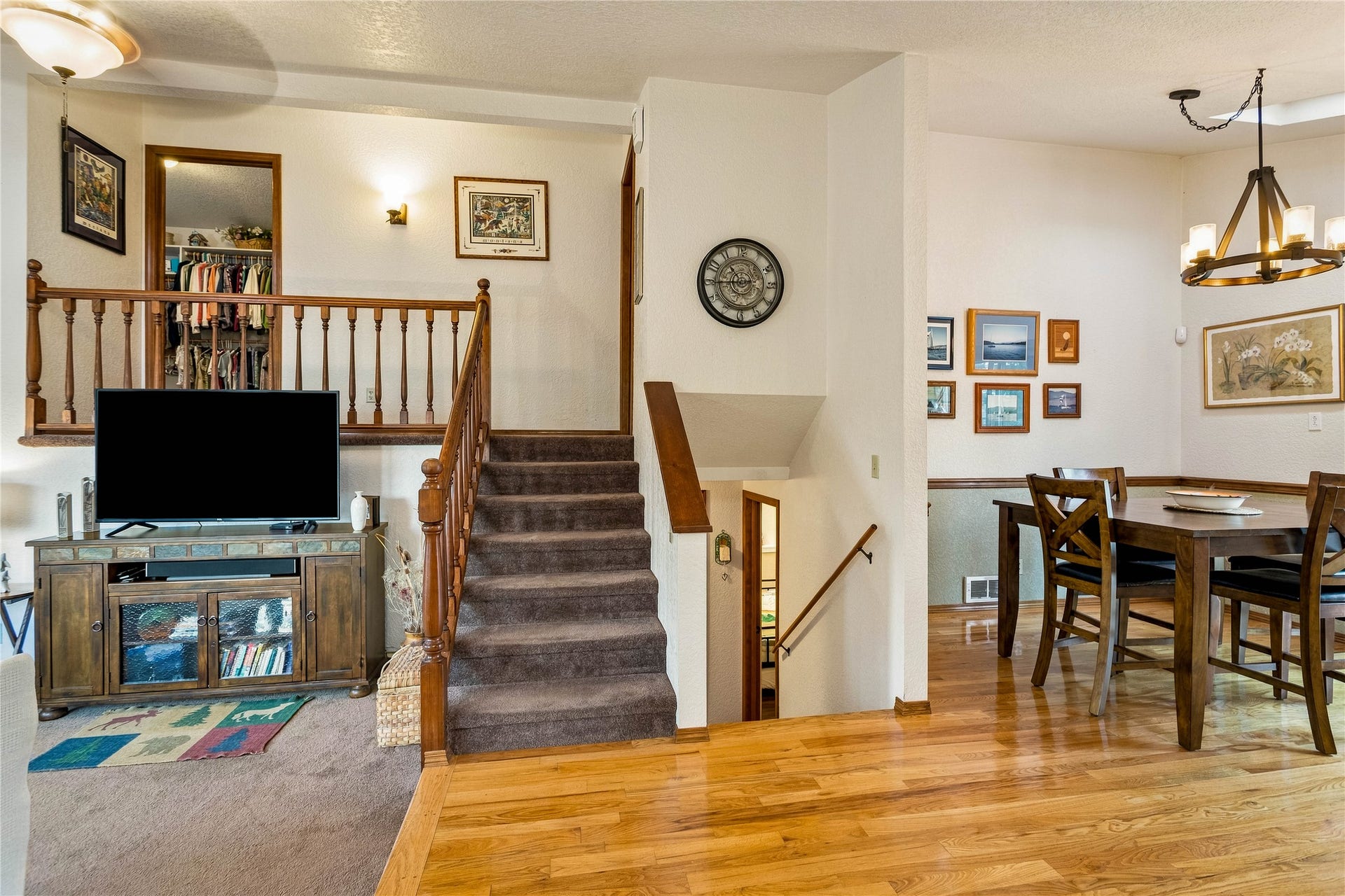 Stairs up to two bedrooms and down to two bedrooms