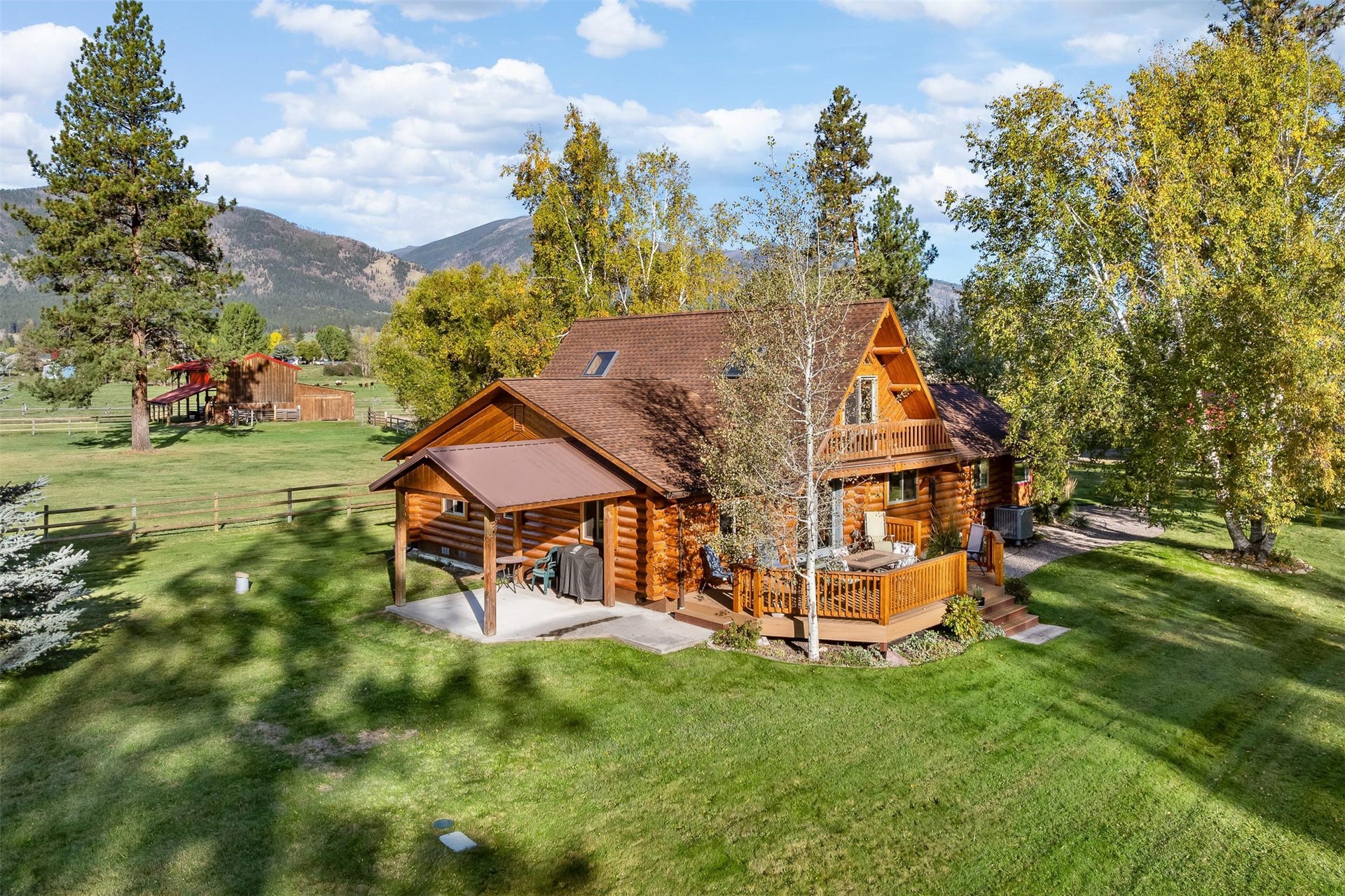 5165 Moores Way, Florence, MT 59833 Back of main home with deck and covered side patio