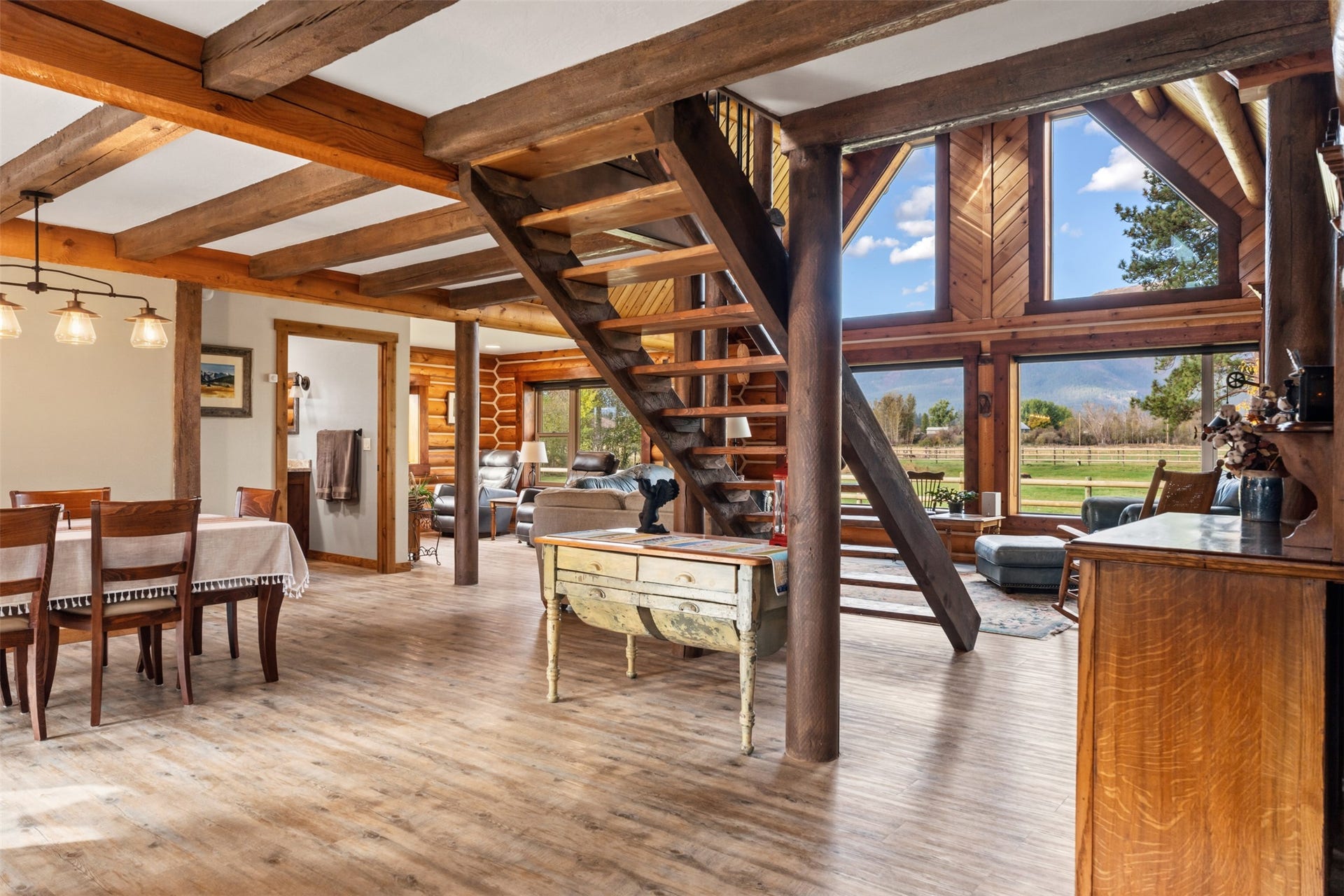 5165 Moores Way, Florence, MT 59833 Main home dining, living and sitting area with floor to ceiling windows with Bitterroot Mountain views
