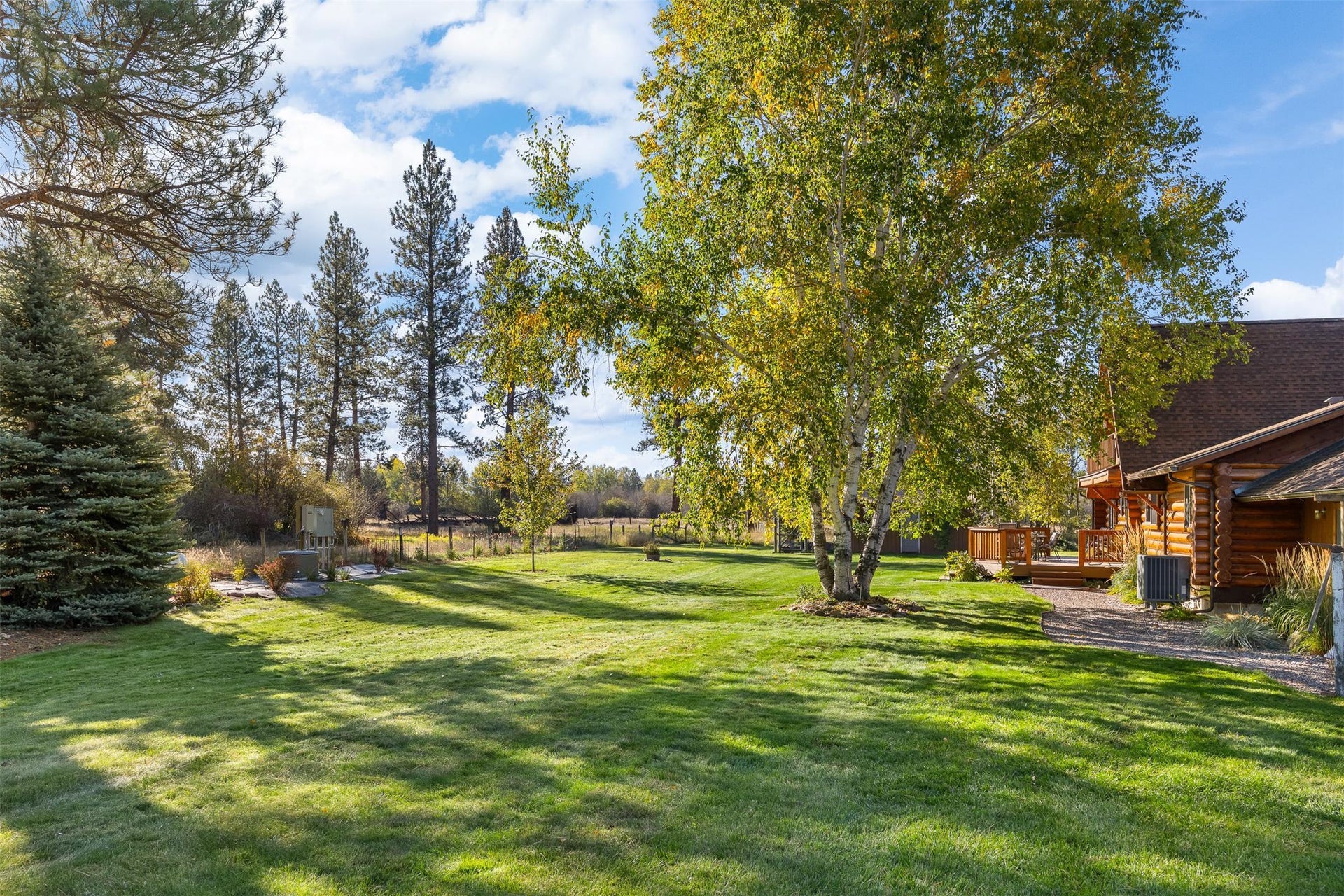 5165 Moores Way, Florence, MT 59833 Back yard of main home with underground sprinklers