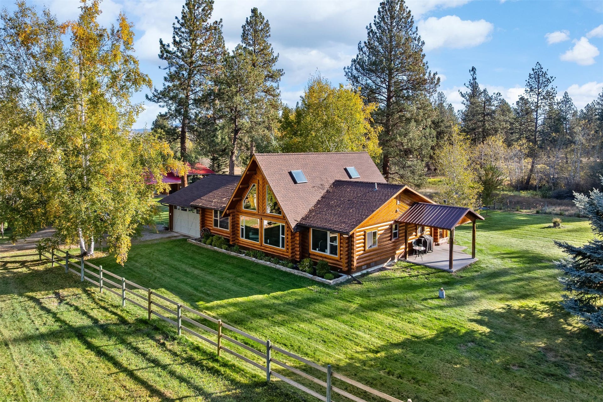 5165 Moores Way, Florence, MT 59833 Updated main log house with attached 2 car garage, 2 bedrooms, 2 bathrooms, loft, living room, sitting room, dining room, laundry room and back deck plus side covered patio