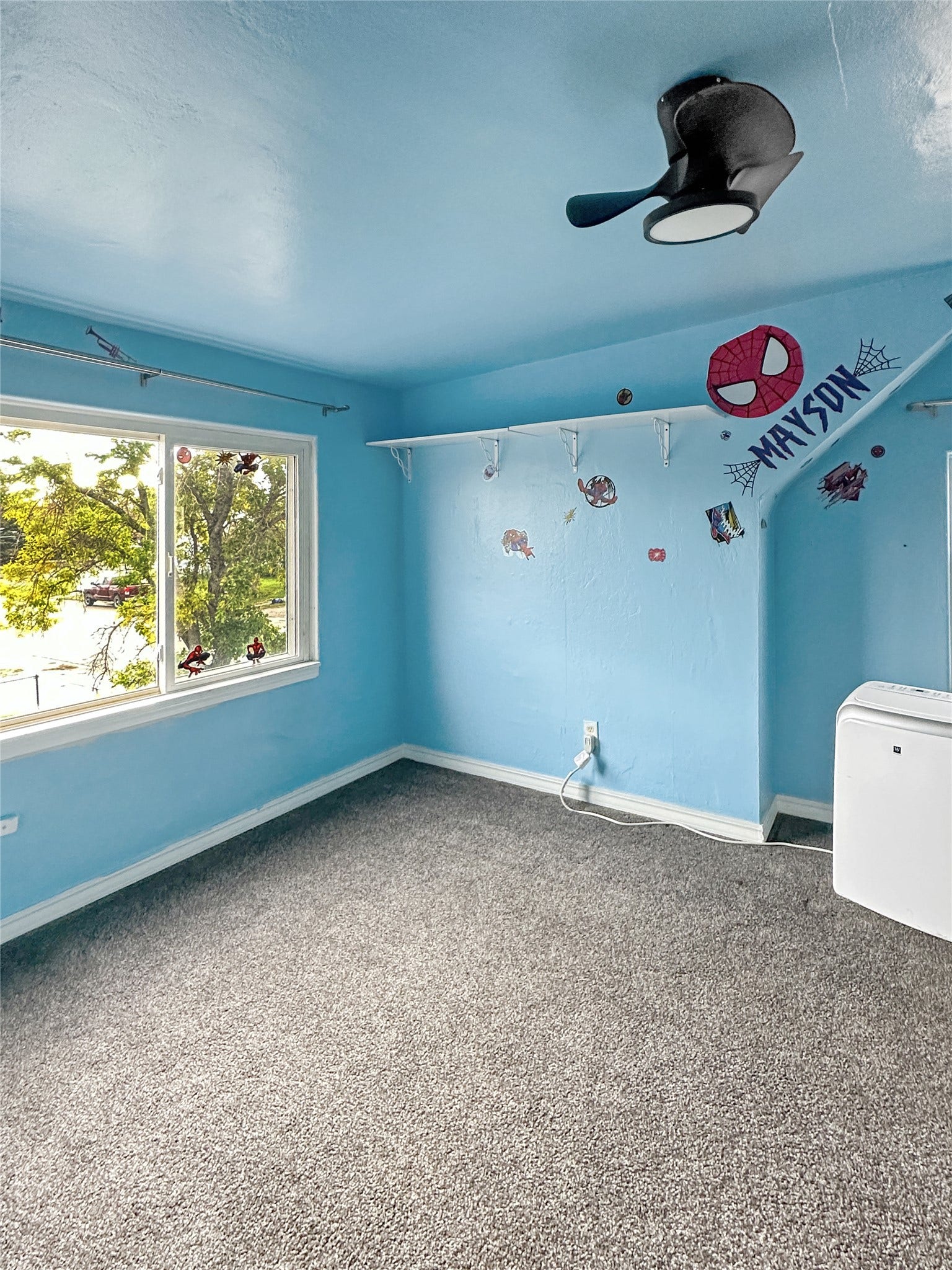 1123 2nd Street N, Shelby, MT 59474 Wall-to-wall carpeting and a ceiling fan are featured in this room with a window and shelving