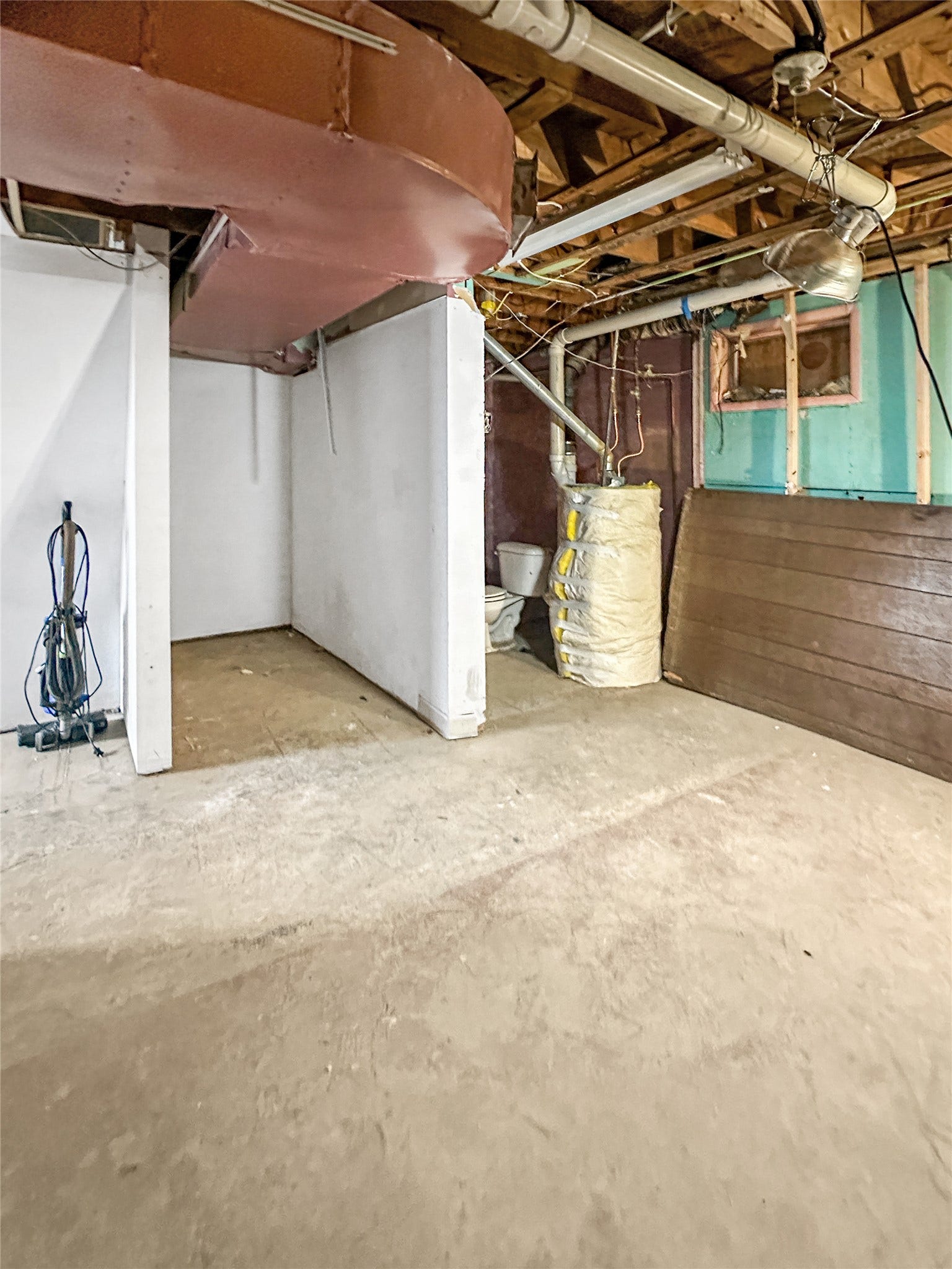 1123 2nd Street N, Shelby, MT 59474 concrete floors, unfinished walls with studs, open ceiling, water heater