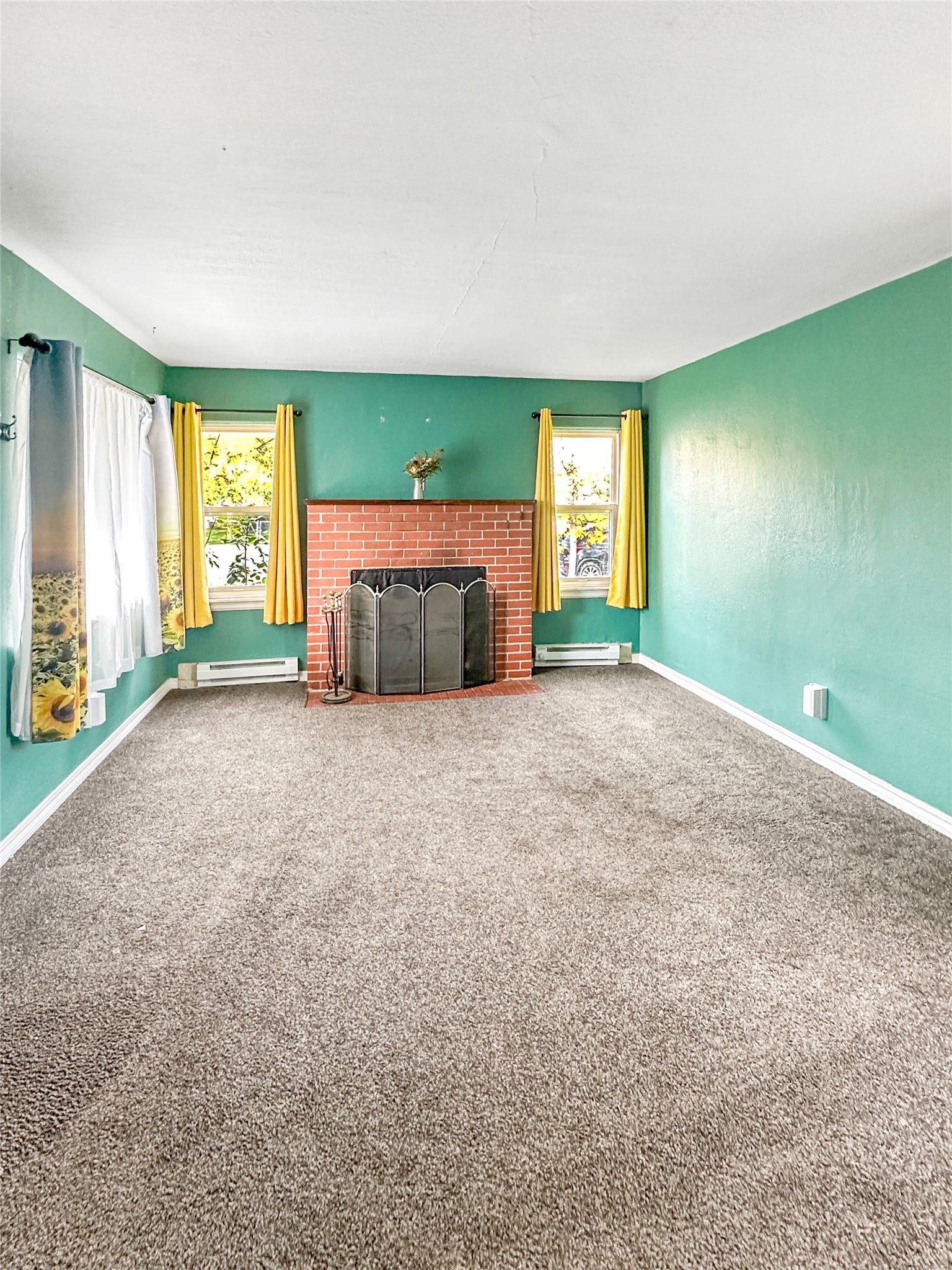 1123 2nd Street N, Shelby, MT 59474 Brick fireplace with a metal screen and hearth