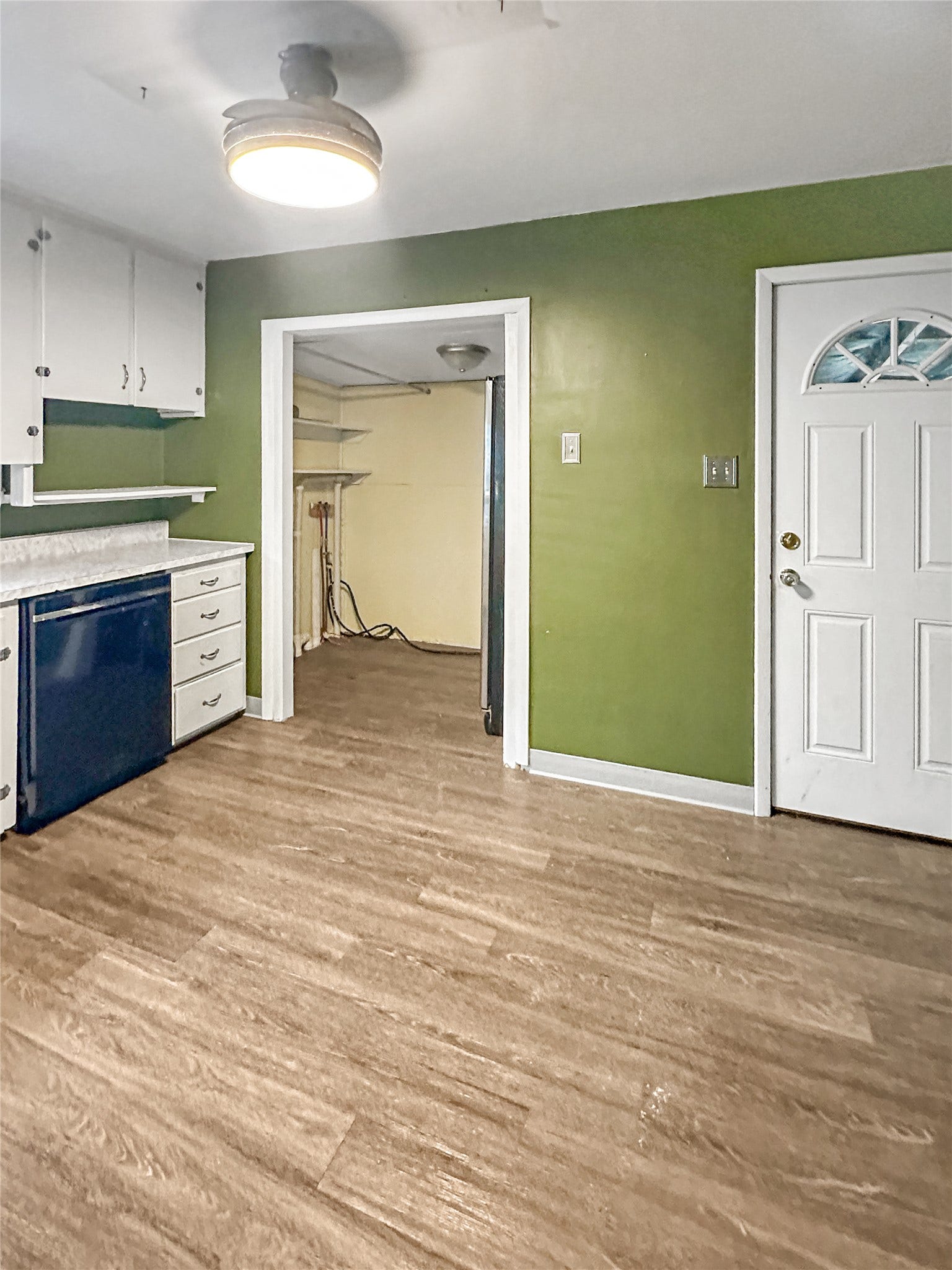 1123 2nd Street N, Shelby, MT 59474 Wood-finish flooring throughout, complemented by white cabinetry and a built-in dishwasher
