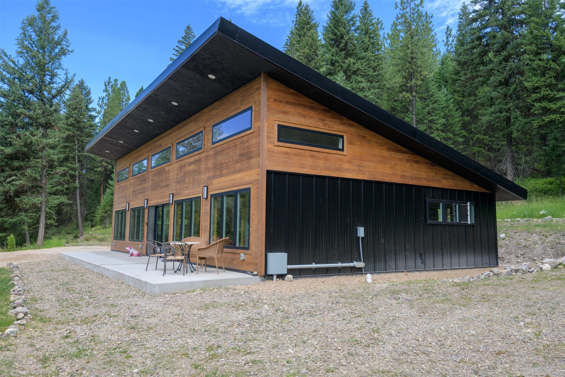 Modern architectural design featuring natural wood siding and black metal accents