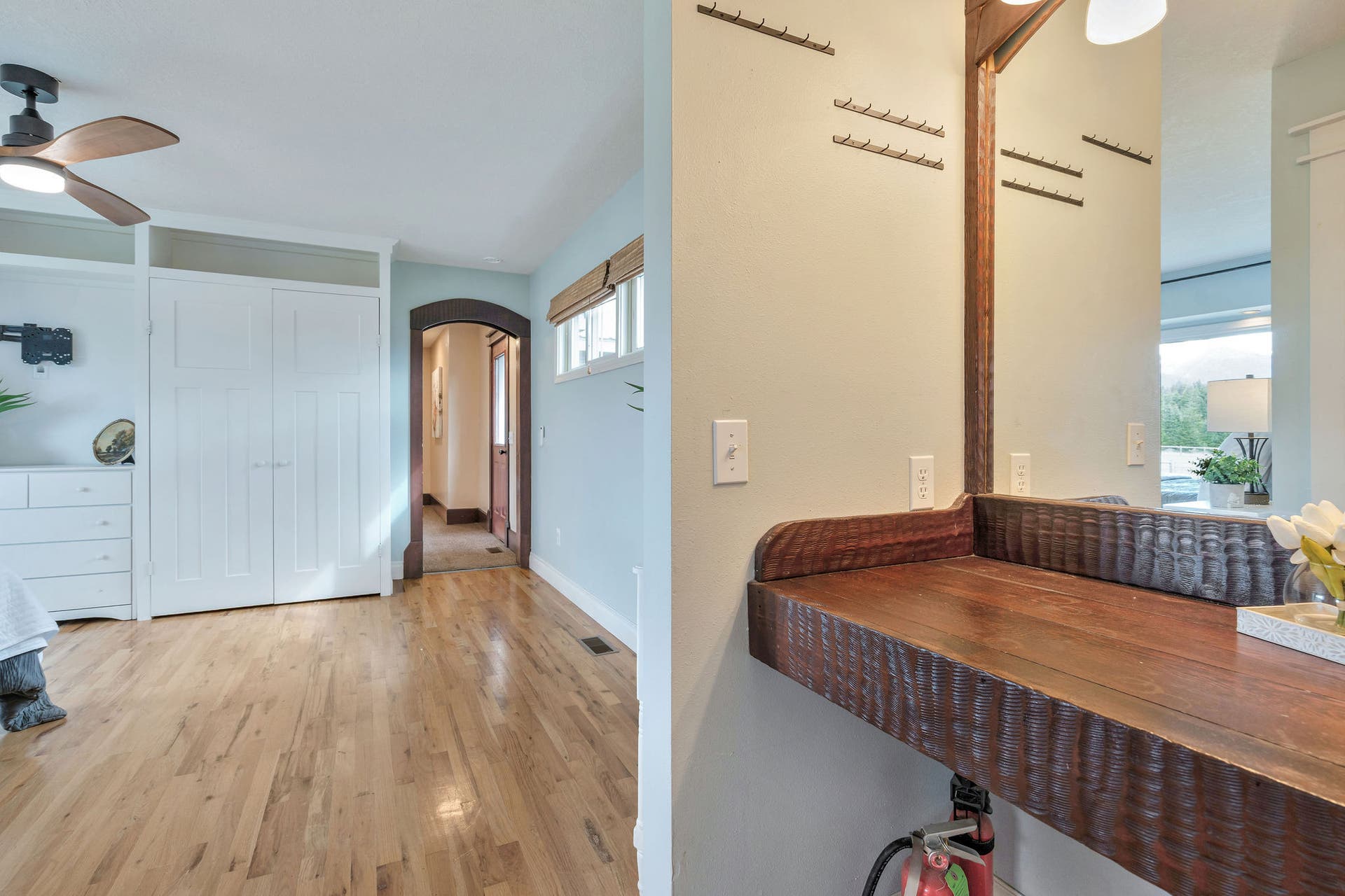 170 Kohler Lake Lane, Kalispell, MT 59901 Primary bedroom, en suite, large picture windows, wood flooring, built-in cabinetry
