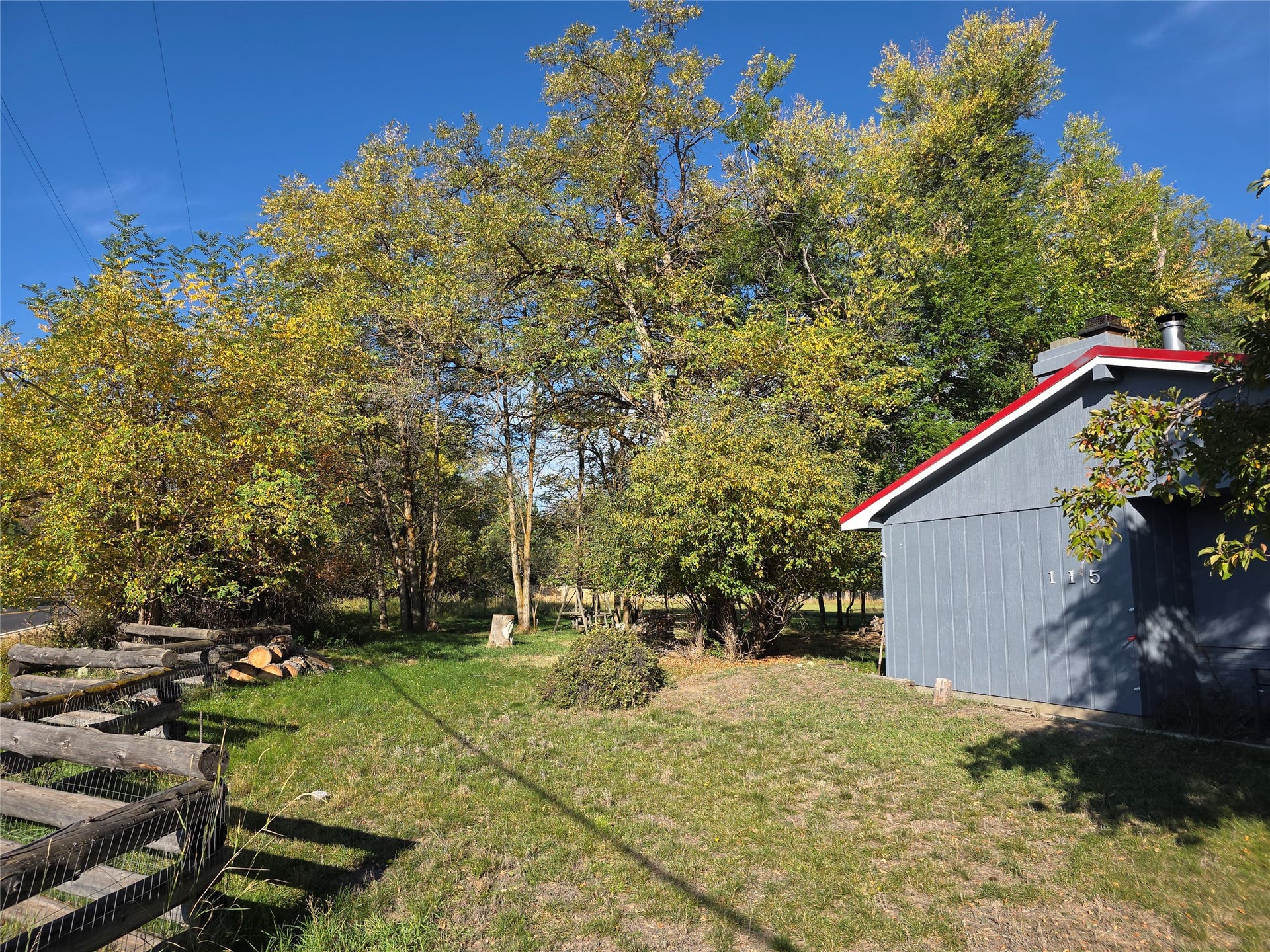 115 Ricketts Road, Hamilton, MT 59840 Exterior building with blue siding and a red roof trim