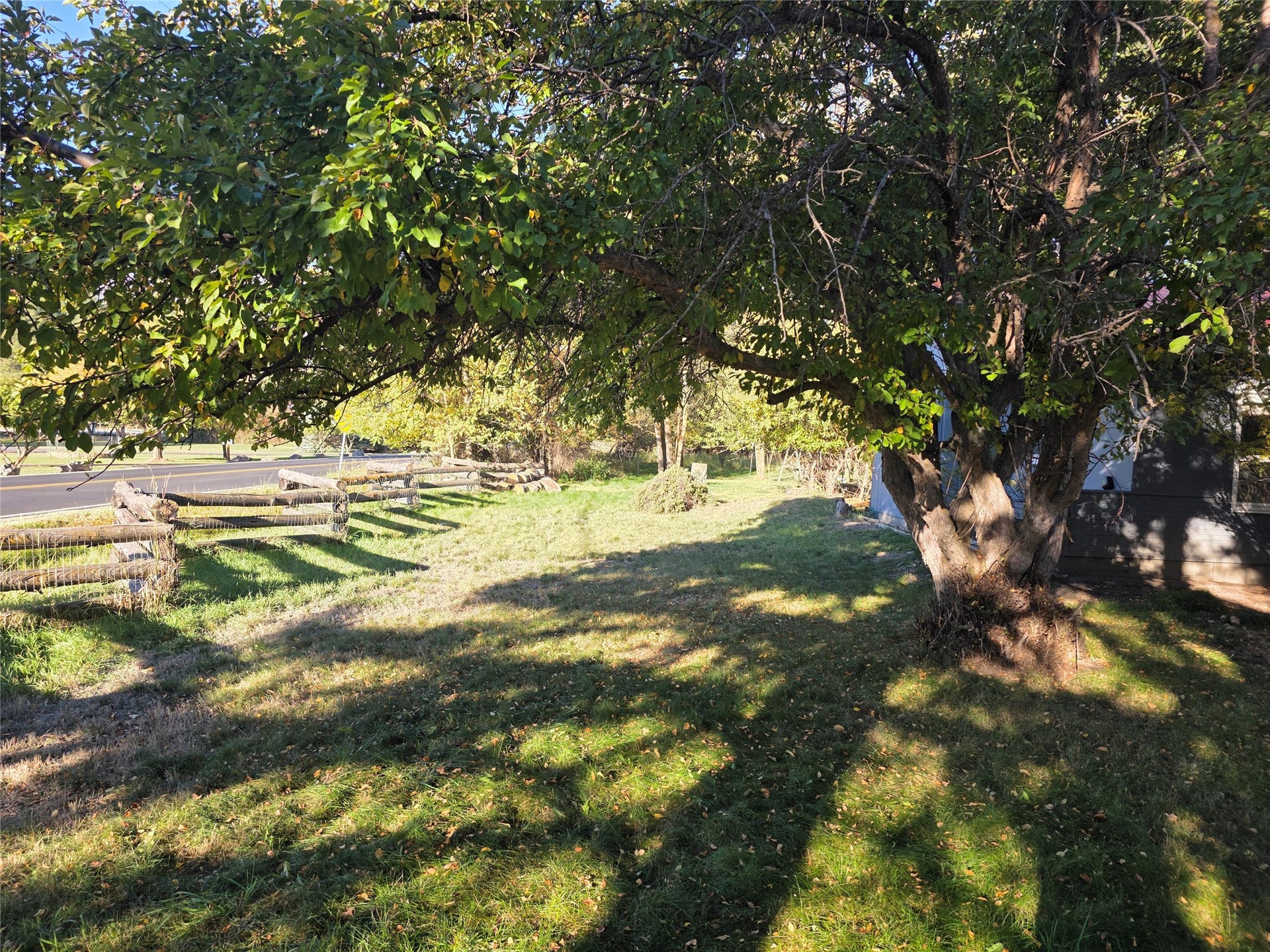 115 Ricketts Road, Hamilton, MT 59840 View of partial fence against paved road and yard
