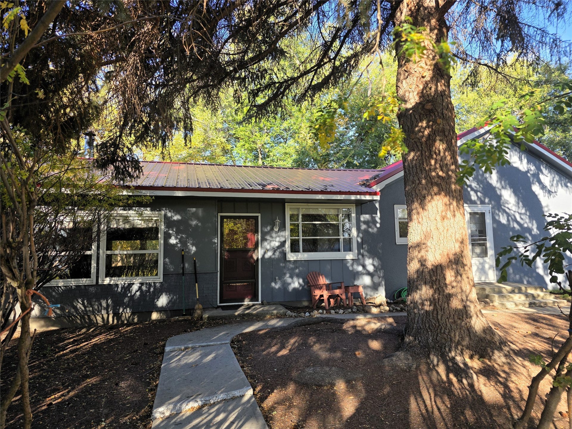 115 Ricketts Road, Hamilton, MT 59840 Gray exterior with red metal roofing