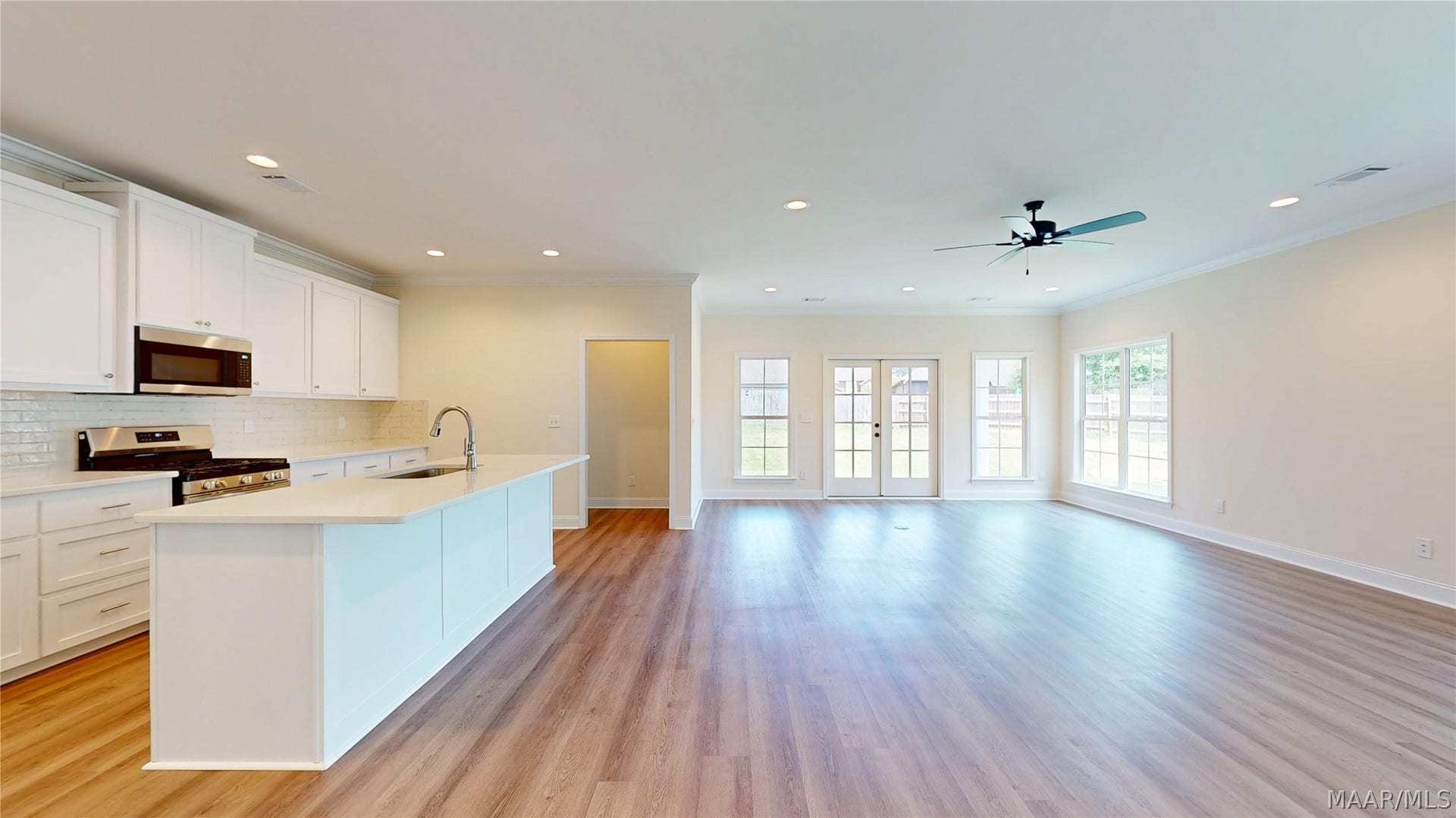 Open Floor Plan with Den, Dining Area, and Kitchen