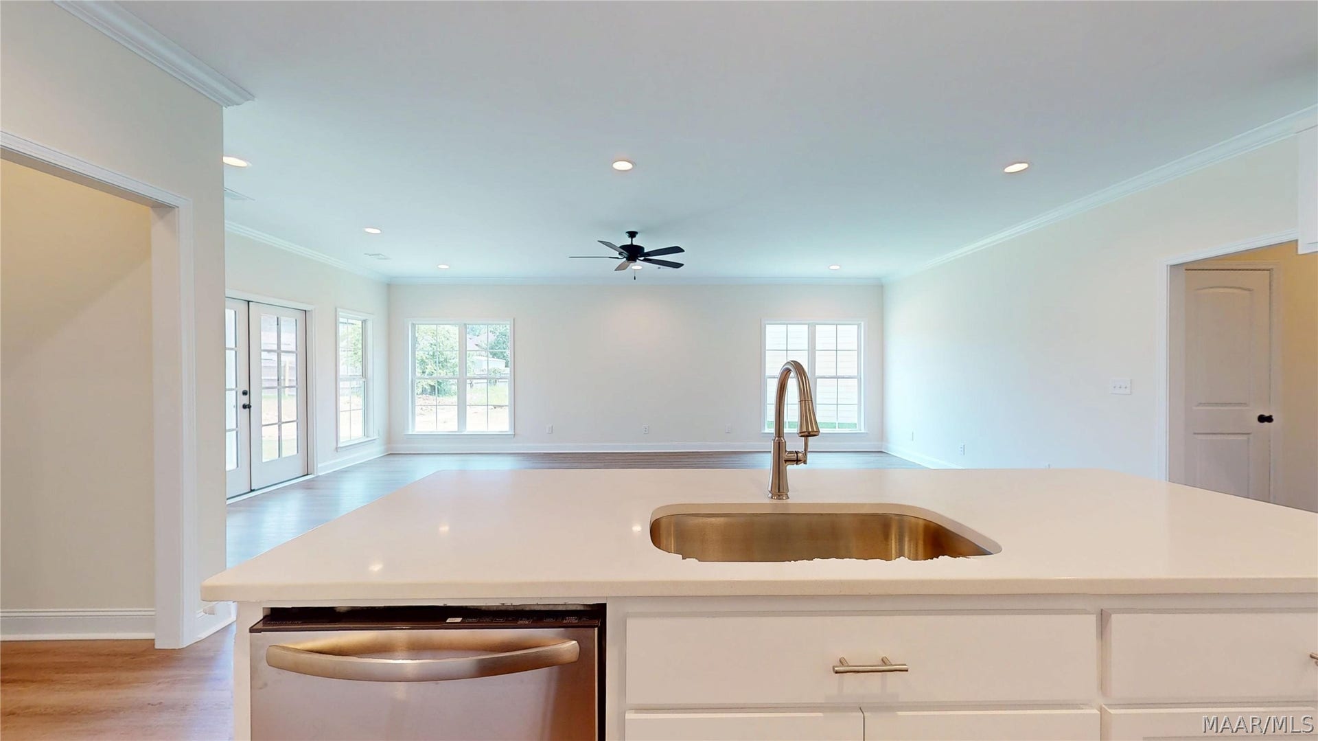 Kitchen Island looks out to Den/Dining Area