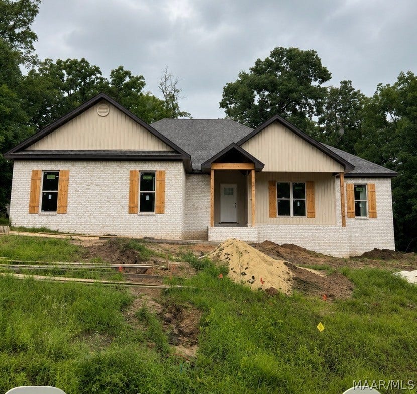 Shutters and columns to be stained dark- dirt added and landscaping to come-dark railings will be added as well