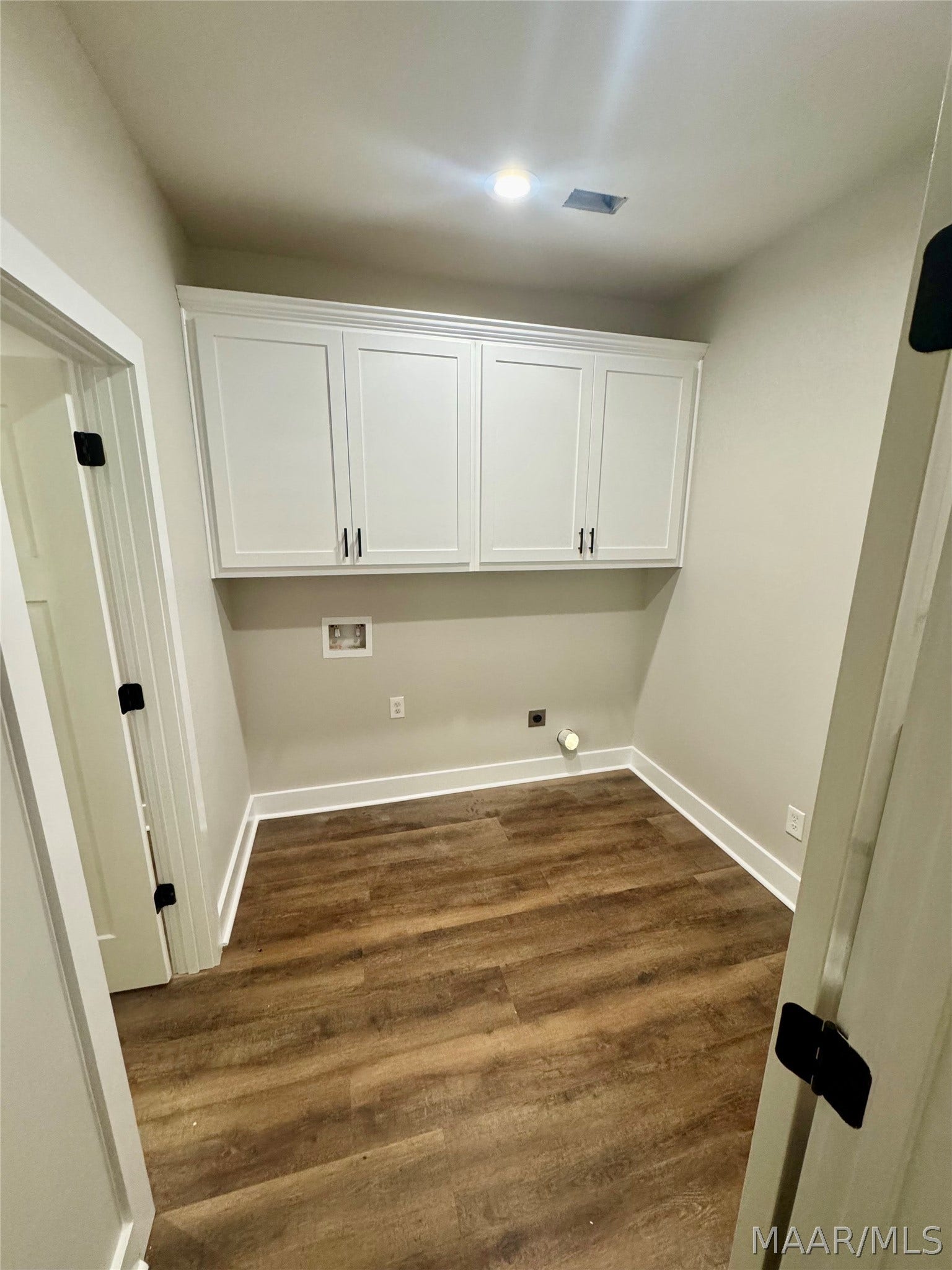 Laundry room with access to main bedroom closet