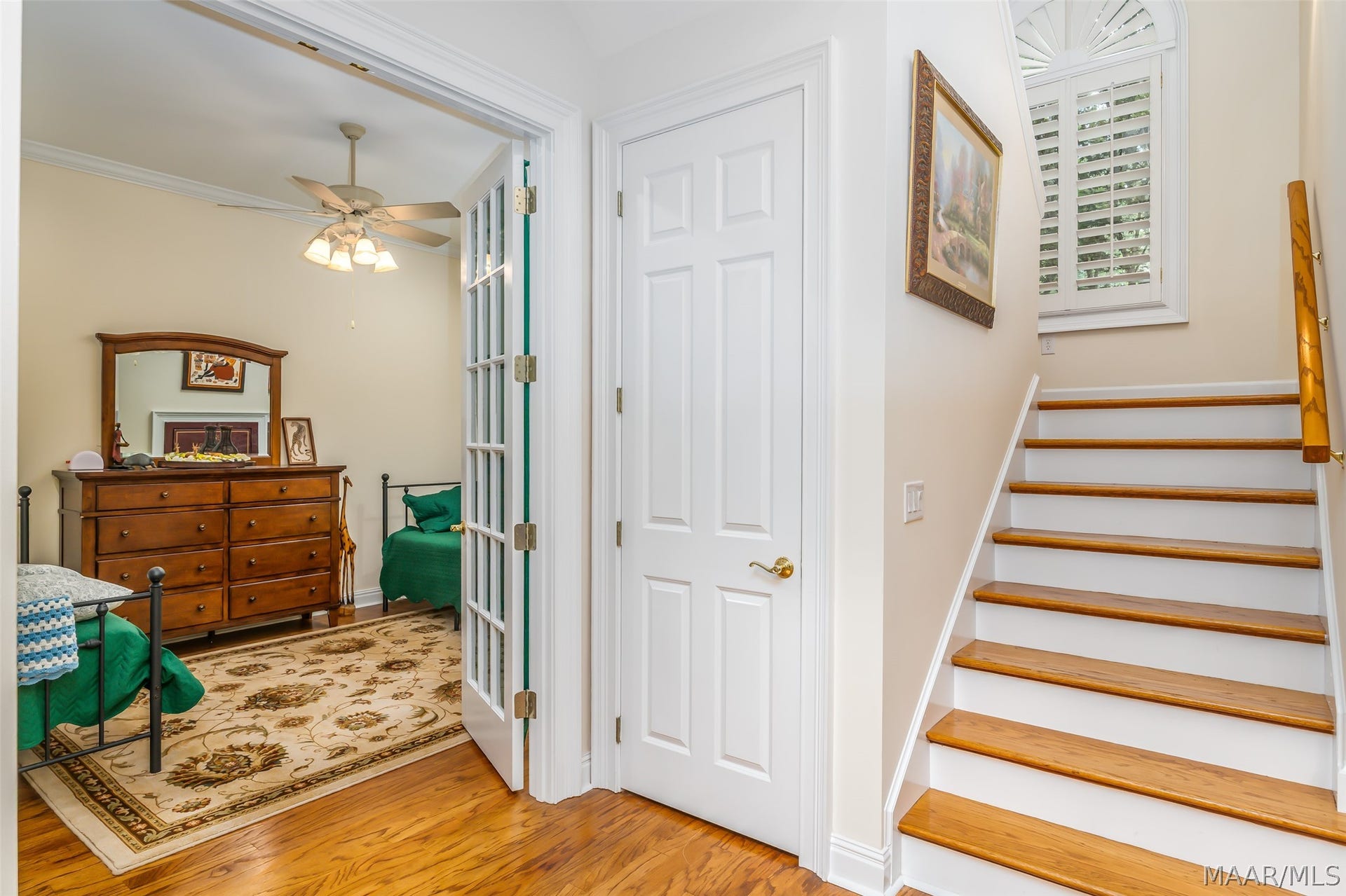 Tucked just off the front entry, offering privacy and easy access to the upper level.