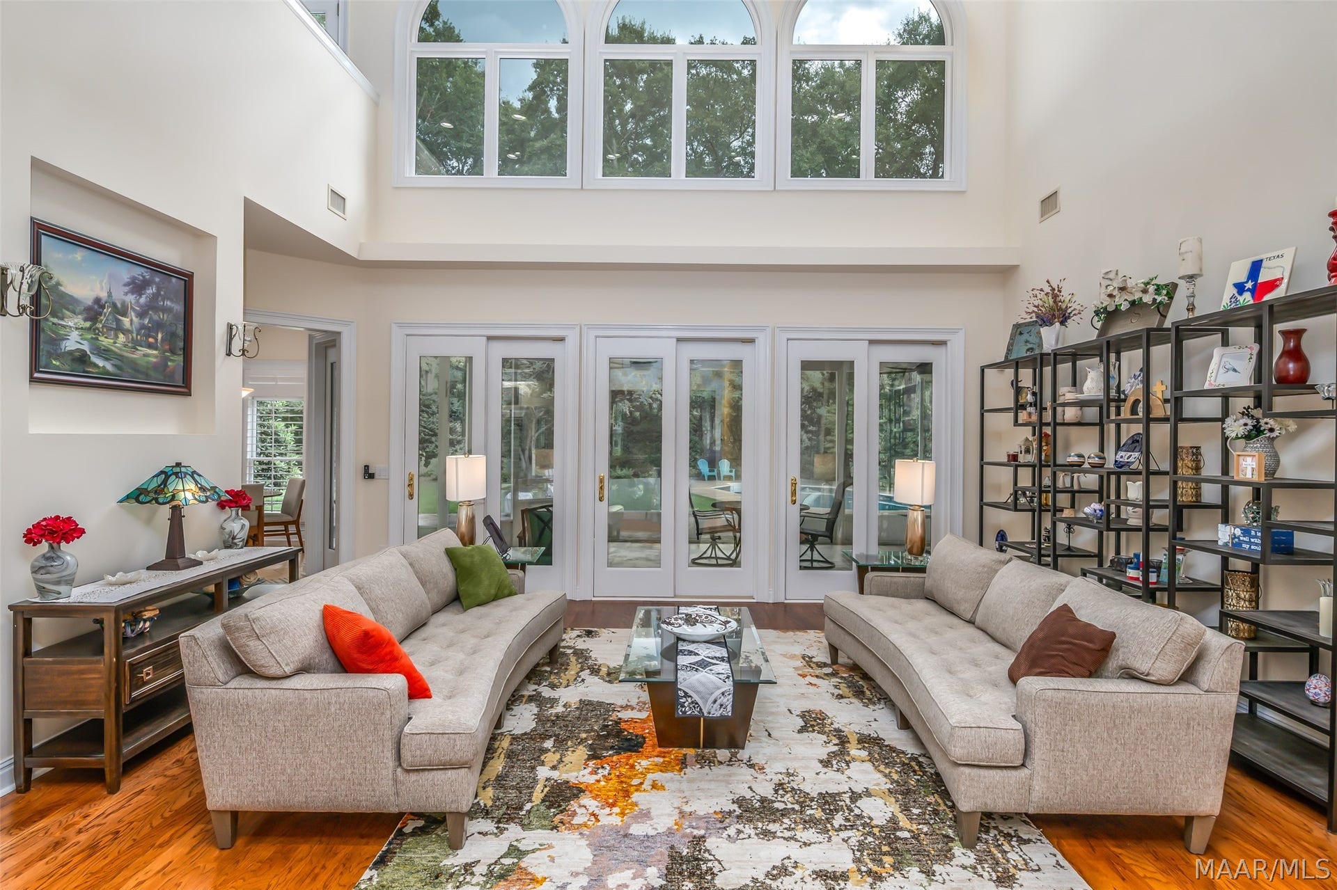 Floor-to-ceiling windows creating a bright airy atmosphere