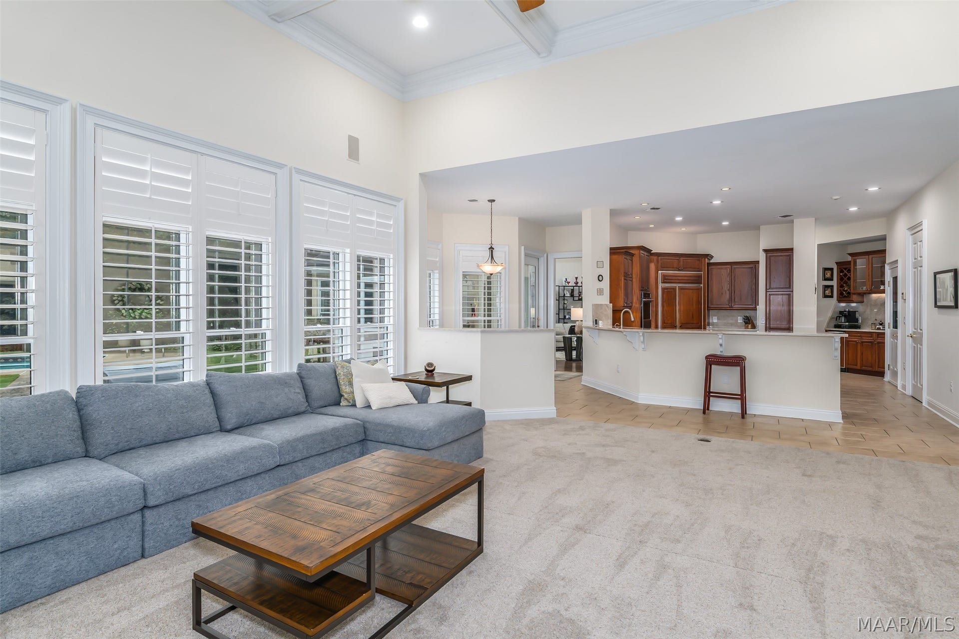 An expansive family room flows seamlessly into the kitchen and breakfast area, creating an open, comfortable space ideal for everyday living and entertaining.