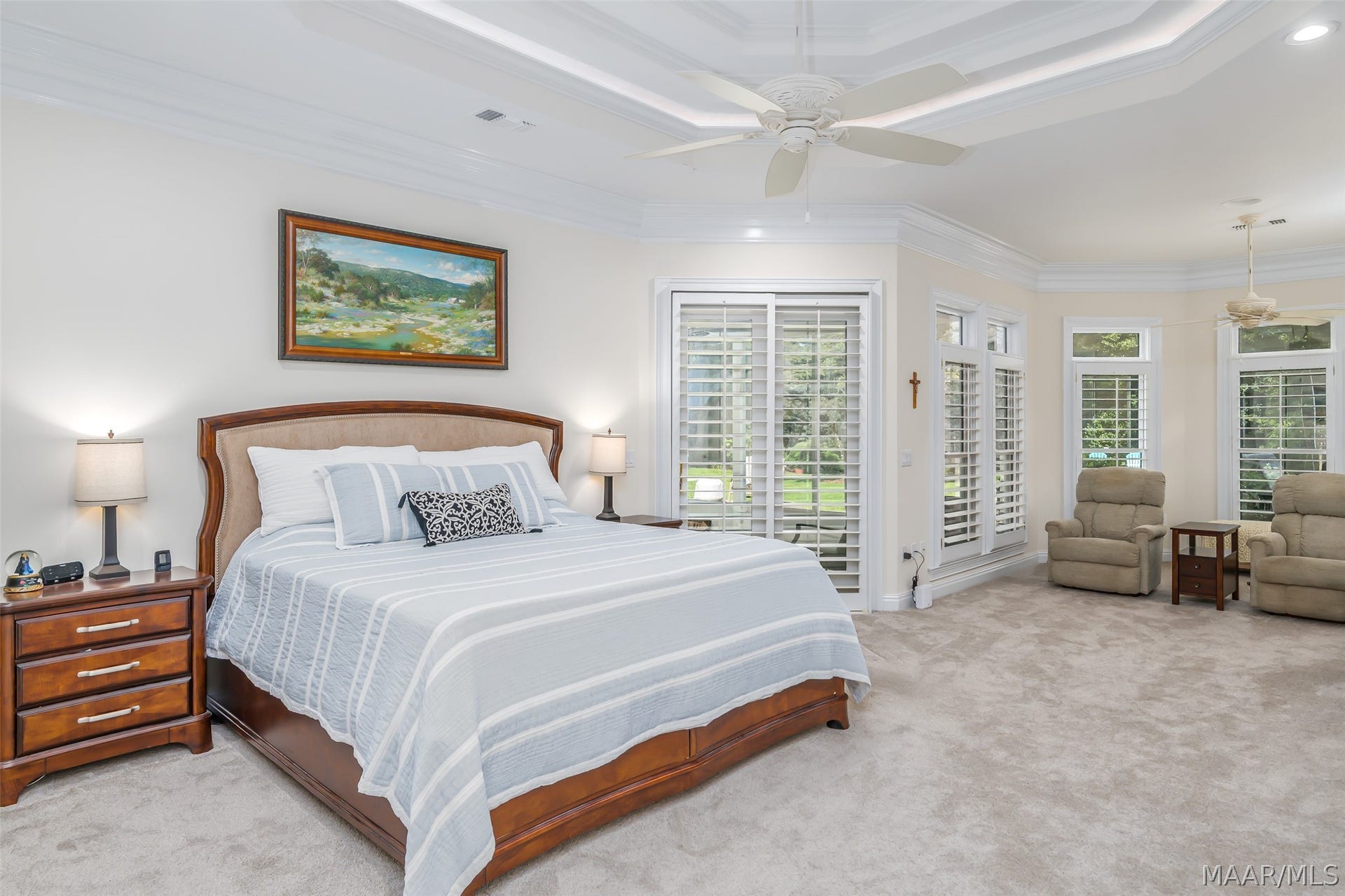 Generously sized owners suite with an adjoining sitting area & fire place.