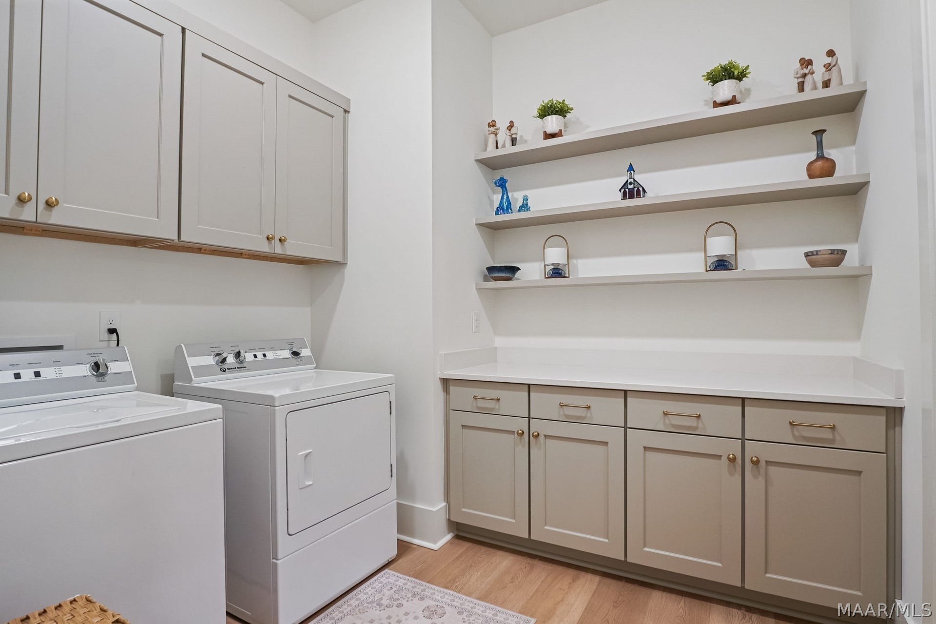 581 King's Meadow Street, Pike Road, AL 36064 The laundry room has plenty of space for storage and a counter for folding.