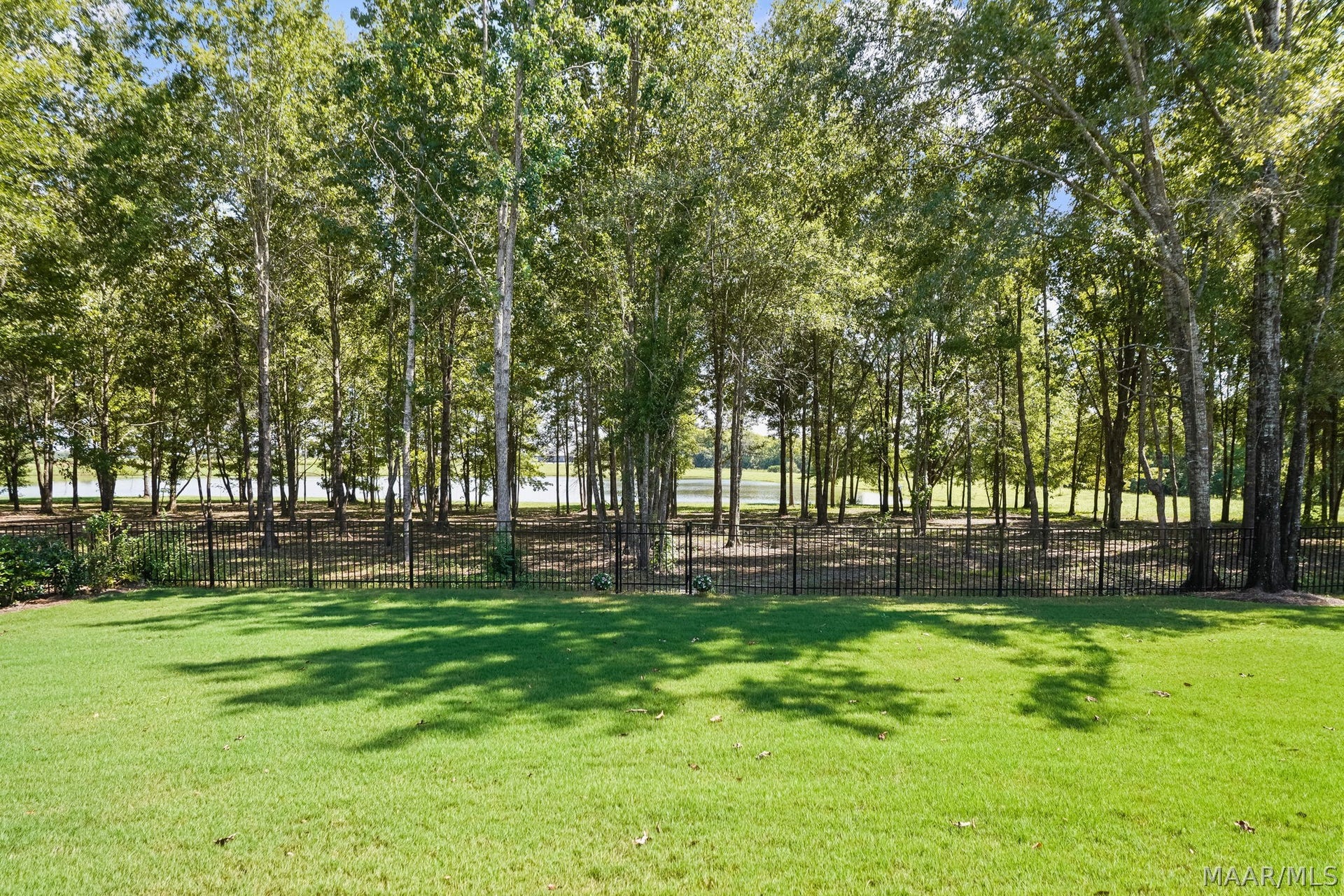 581 King's Meadow Street, Pike Road, AL 36064 The backyard looking toward the water. It is fully fenced.